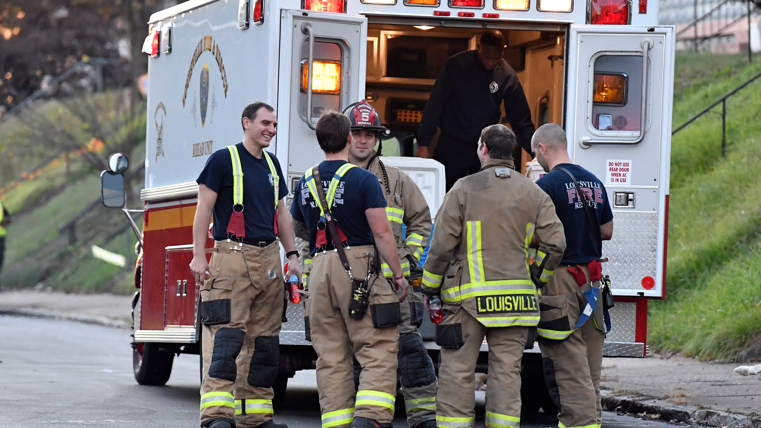 Members of the Louisville Fire Departments check their gear as they prepare to enter Givaudan Sense Colour following an explosion at the facility in Louisville, Ky., Tuesday, Nov. 12, 2024. (AP Photo/Timothy D. Easley)