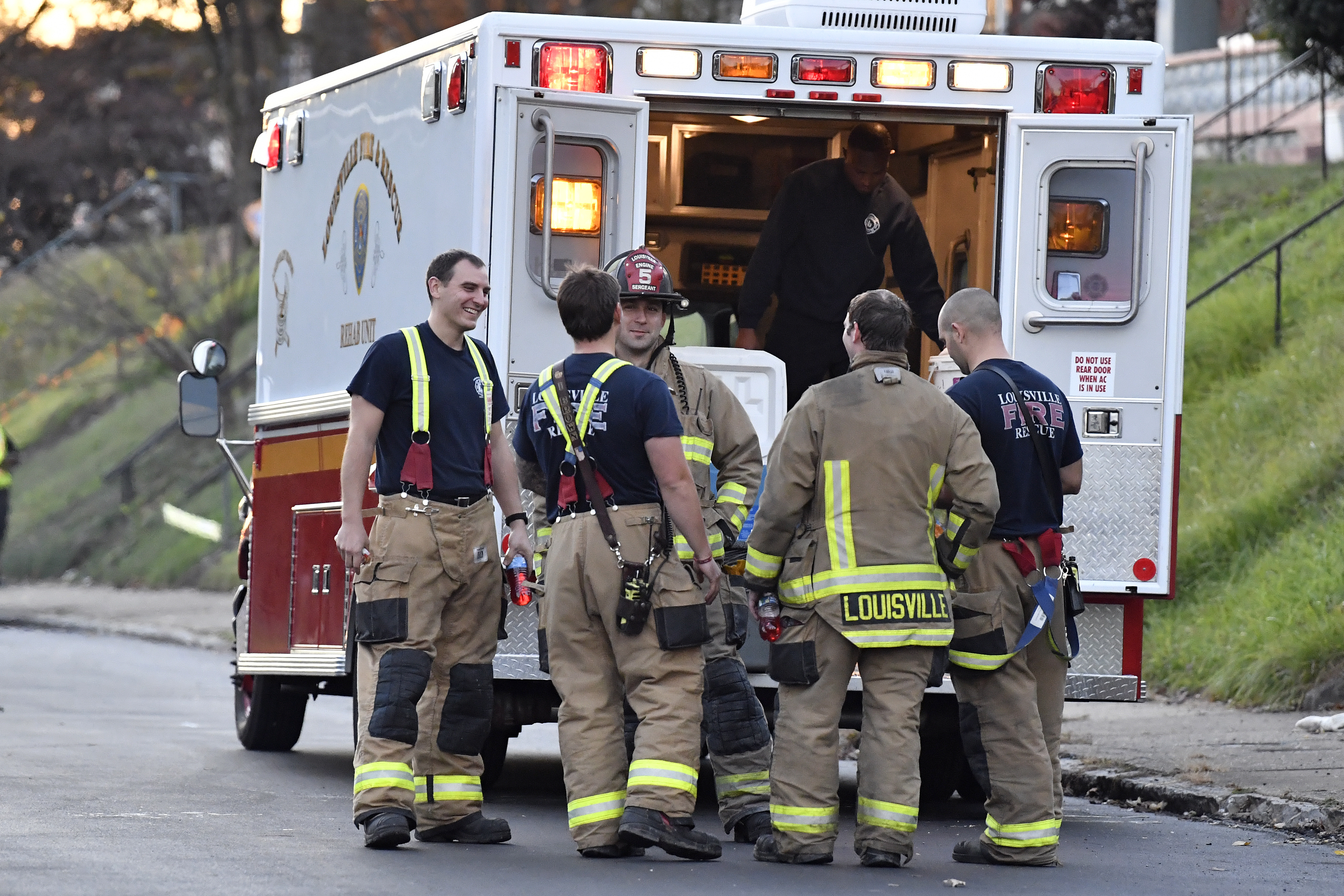 Members of the Louisville Fire Departments check their gear as they prepare to enter Givaudan Sense Colour following an explosion at the facility in Louisville, Ky., Tuesday, Nov. 12, 2024. (AP Photo/Timothy D. Easley)