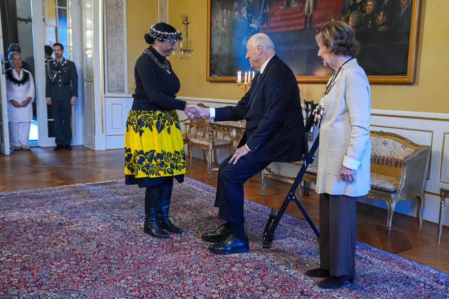 Norway's King Harald, centre, and Queen Sonja, right, welcome Rapa Nui Chilean politician Laura Tarita Rapu Alarcon, at the Royal Palace, in Oslo, Norway, Tuesday, Nov. 12, 2024. (Lise Åserud/NTB Scanpix via AP)