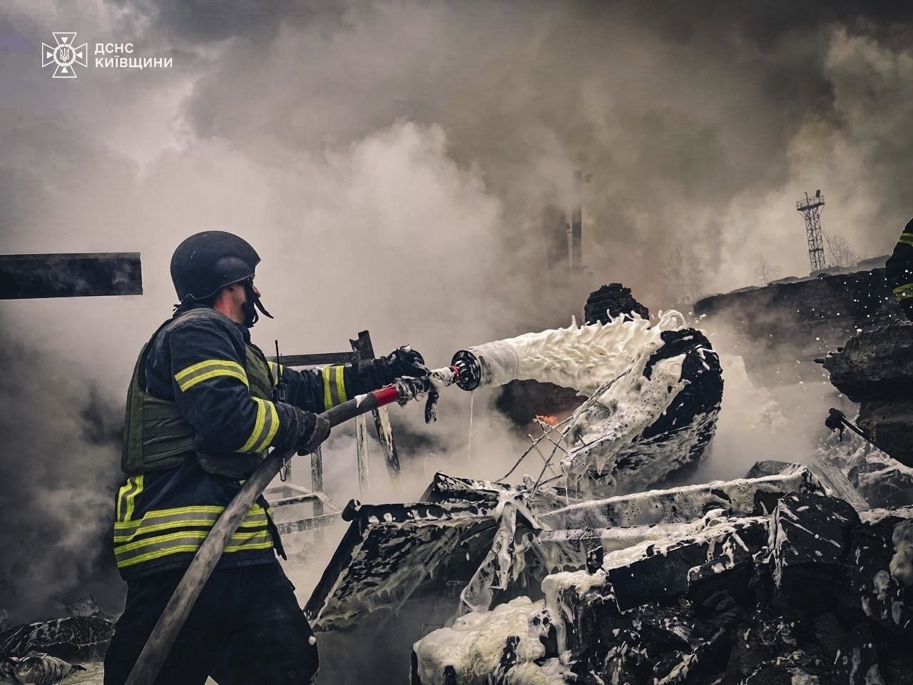 In this photo provided by the Ukrainian Emergency Service on Nov. 13, 2024, rescue workers extinguish a fire of a building destroyed by a Russian strike in Brovary, outside Kyiv, Ukraine. (Ukrainian Emergency Service via AP)