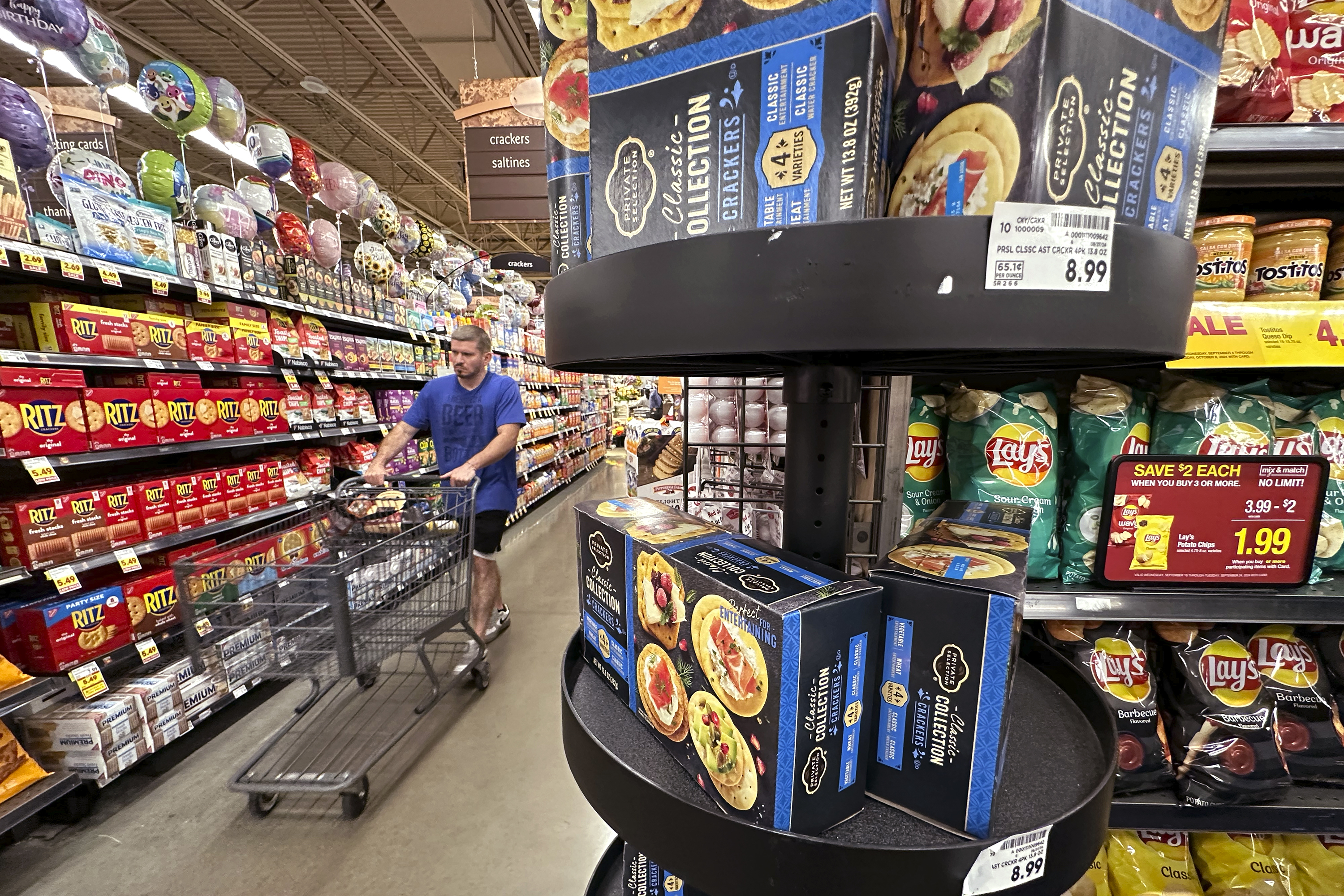 FILE - A customer shops at a grocery store in Chicago, Sept. 19, 2024. (AP Photo/Nam Y. Huh, File)