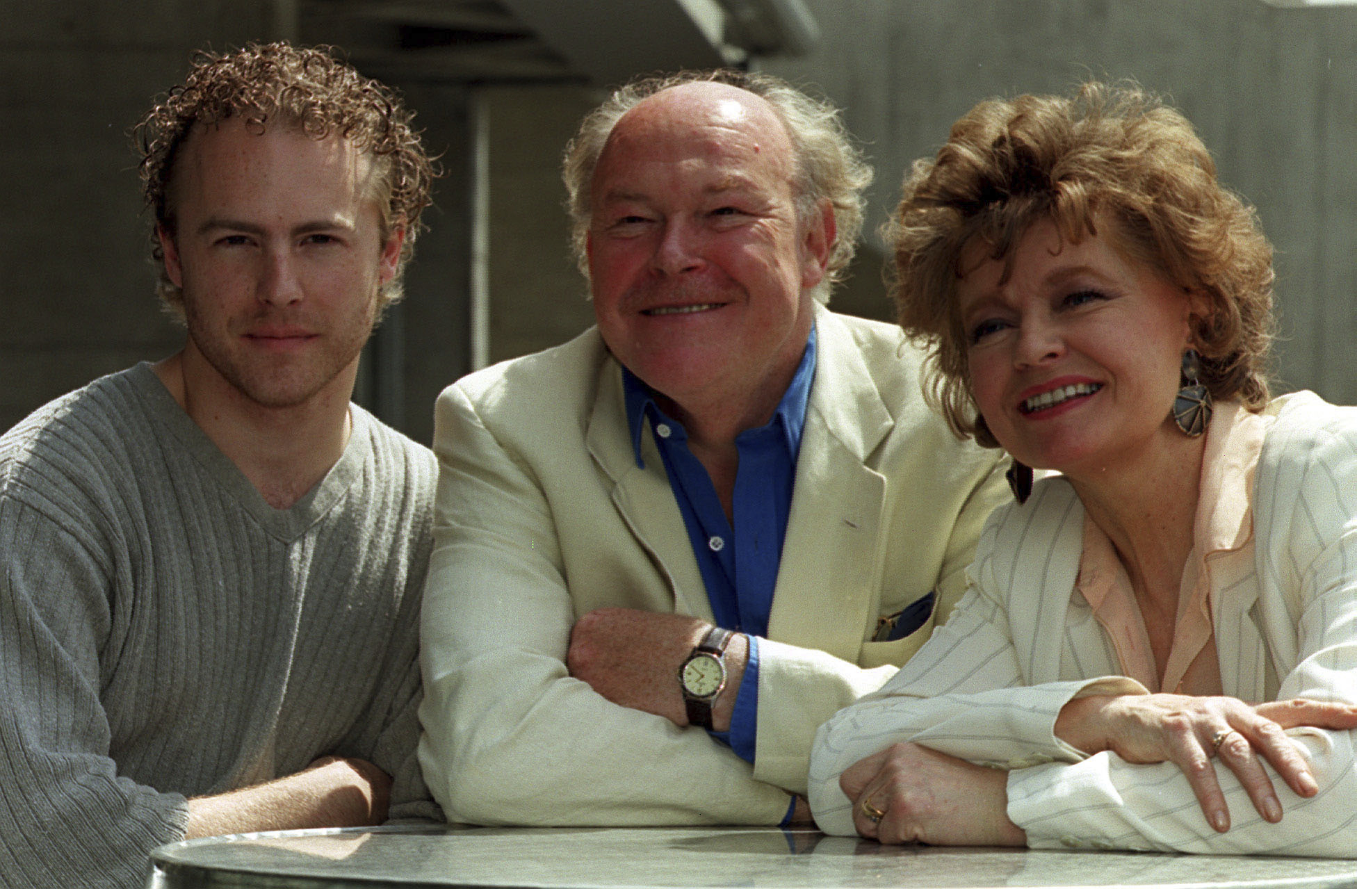 From left, actors Sam West, his father Timothy West and his mother Prunella Scales during a photocall in London, July 15, 1999. (Michael Crabtree/PA via AP)