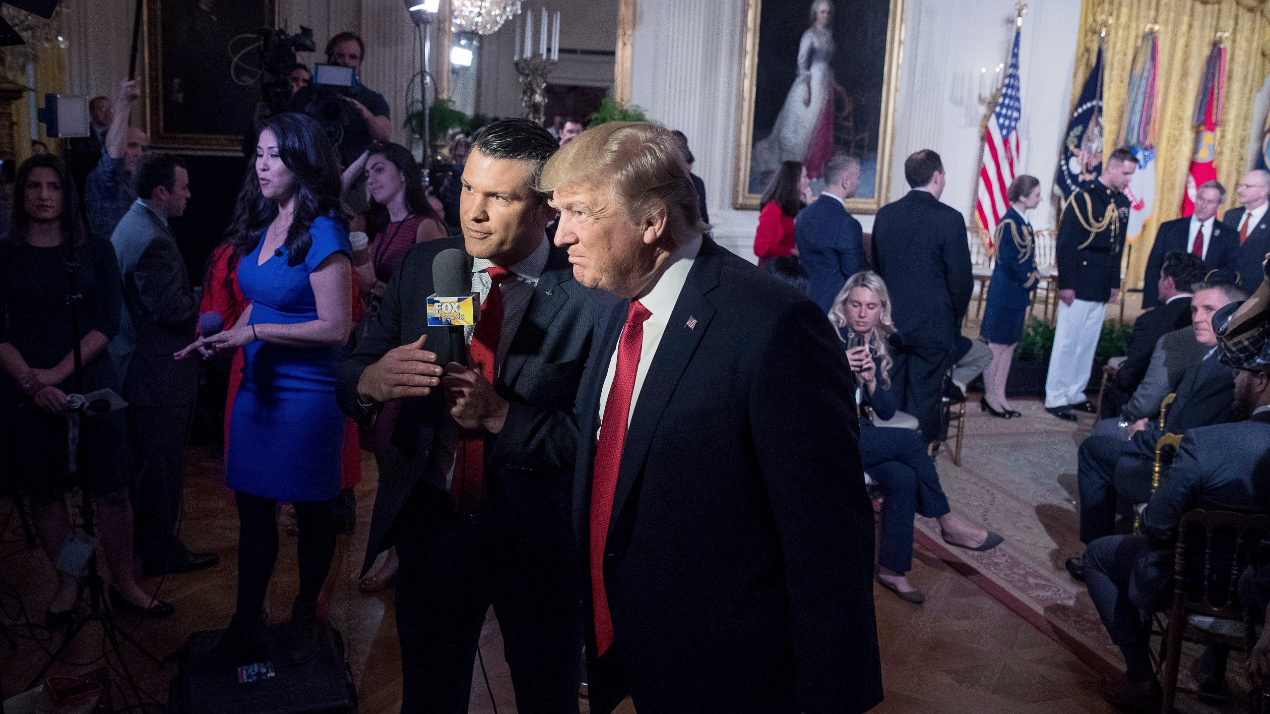 File - President Donald Trump appears on Fox & Friends co-host Pete Hegseth at a Wounded Warrior Project Soldier Ride event in the East Room of the White House in Washington, Thursday, April 6, 2017. (AP Photo/Andrew Harnik, File)