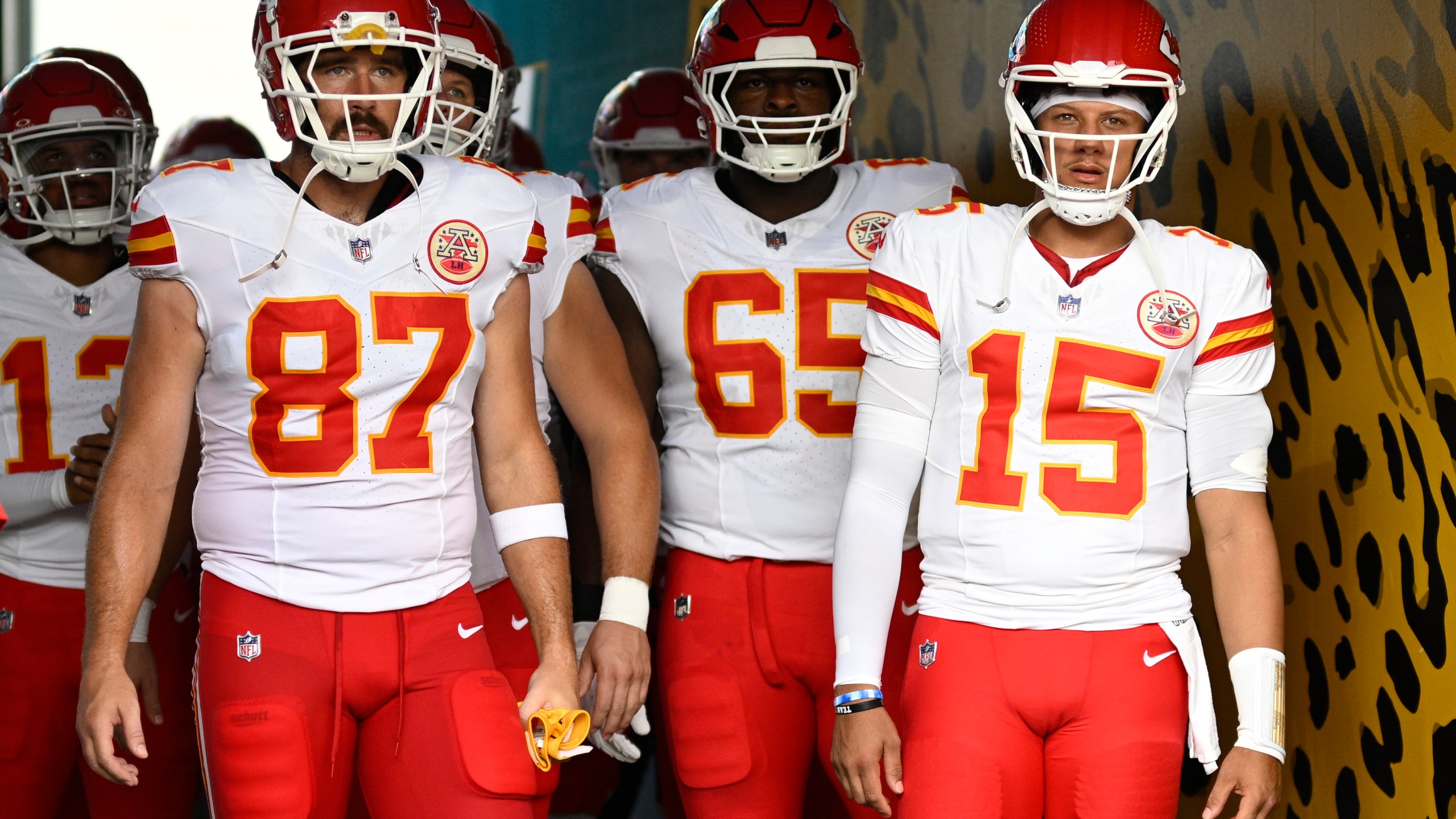 FILE - Kansas City Chiefs tight end Travis Kelce (87) and quarterback Patrick Mahomes (15) wait to lead the team onto the field before a preseason NFL football game against the Jacksonville Jaguars, Aug. 10, 2024, in Jacksonville, Fla. (AP Photo/Phelan M. Ebenhack, File)