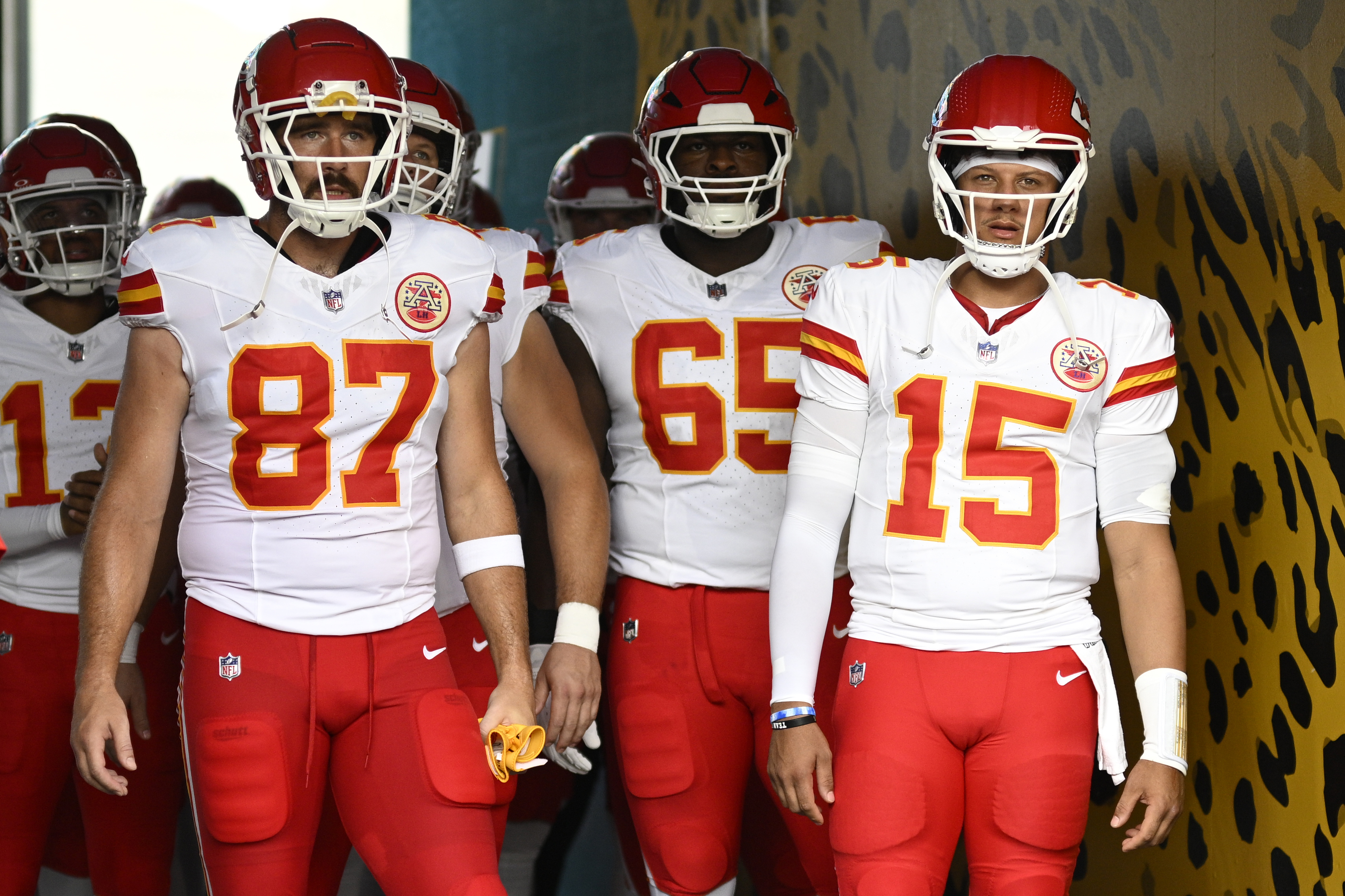 FILE - Kansas City Chiefs tight end Travis Kelce (87) and quarterback Patrick Mahomes (15) wait to lead the team onto the field before a preseason NFL football game against the Jacksonville Jaguars, Aug. 10, 2024, in Jacksonville, Fla. (AP Photo/Phelan M. Ebenhack, File)