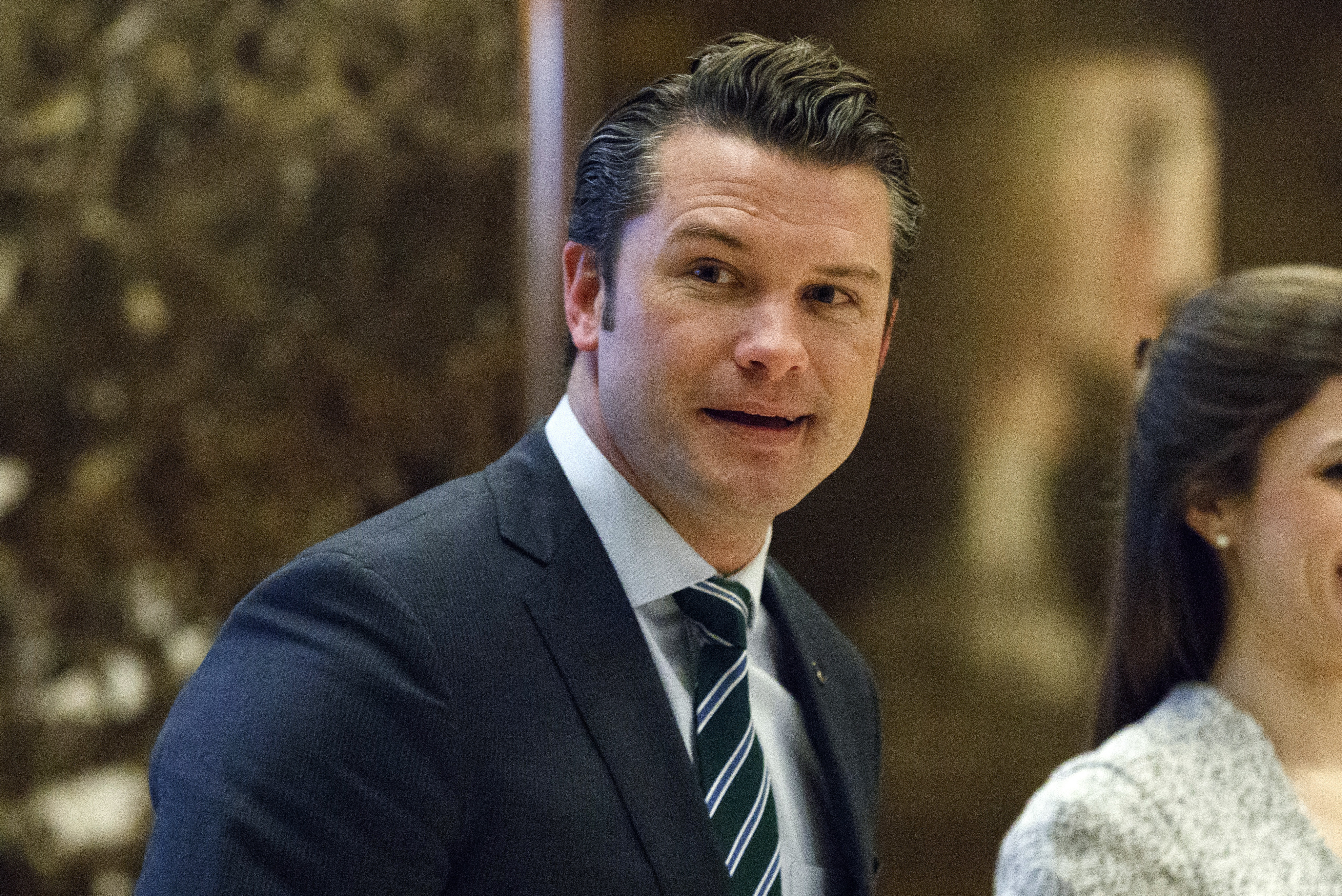 FILE - Pete Hegseth walks to an elevator for a meeting with President-elect Donald Trump at Trump Tower in New York, Dec. 15, 2016. (AP Photo/Evan Vucci, File)