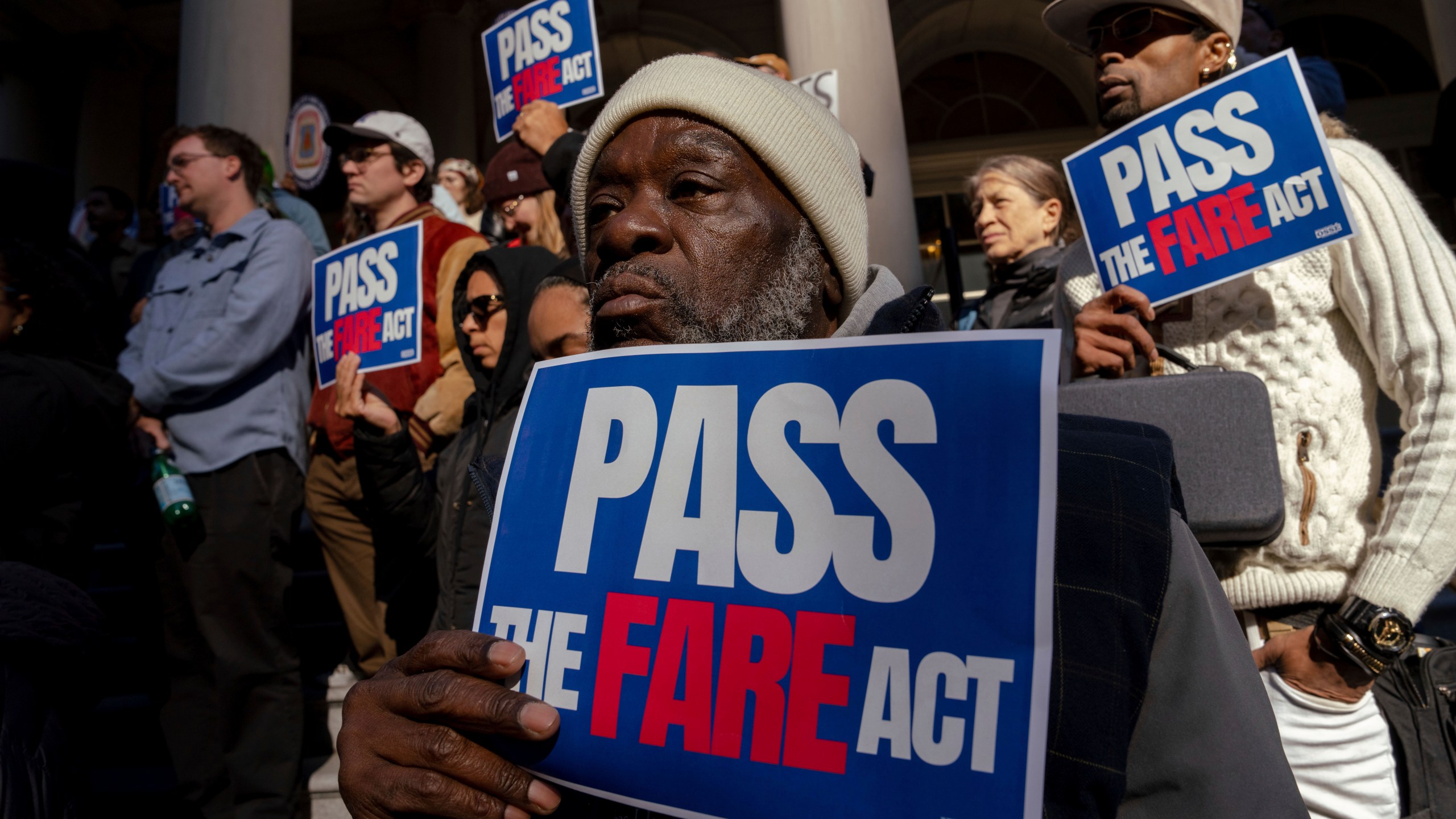 People gather outside of City Hall for a rally in support of the FARE Act ahead of a City Council meeting, Wednesday, Nov. 13, 2024, in New York. (AP Photo/Adam Gray)