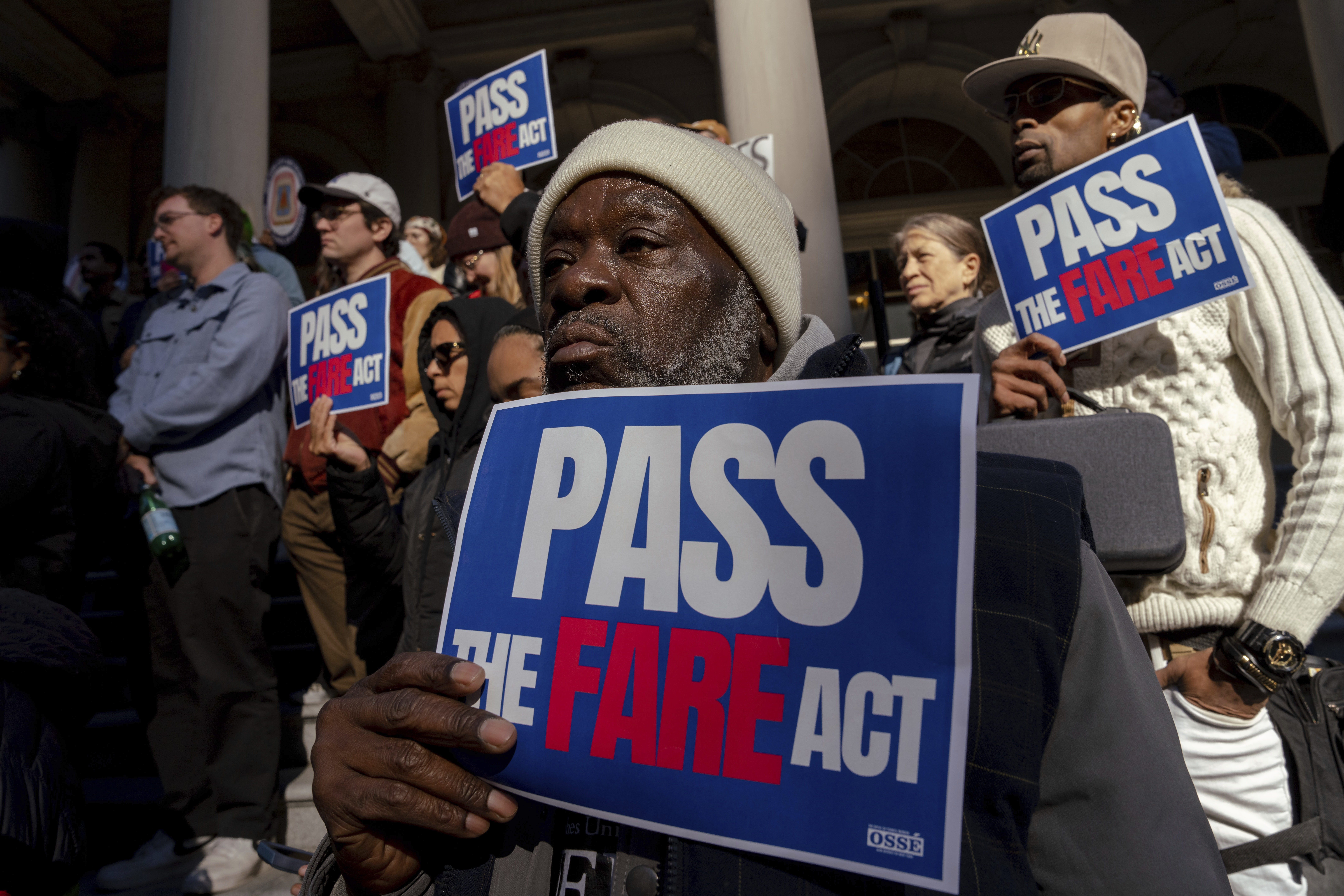 People gather outside of City Hall for a rally in support of the FARE Act ahead of a City Council meeting, Wednesday, Nov. 13, 2024, in New York. (AP Photo/Adam Gray)