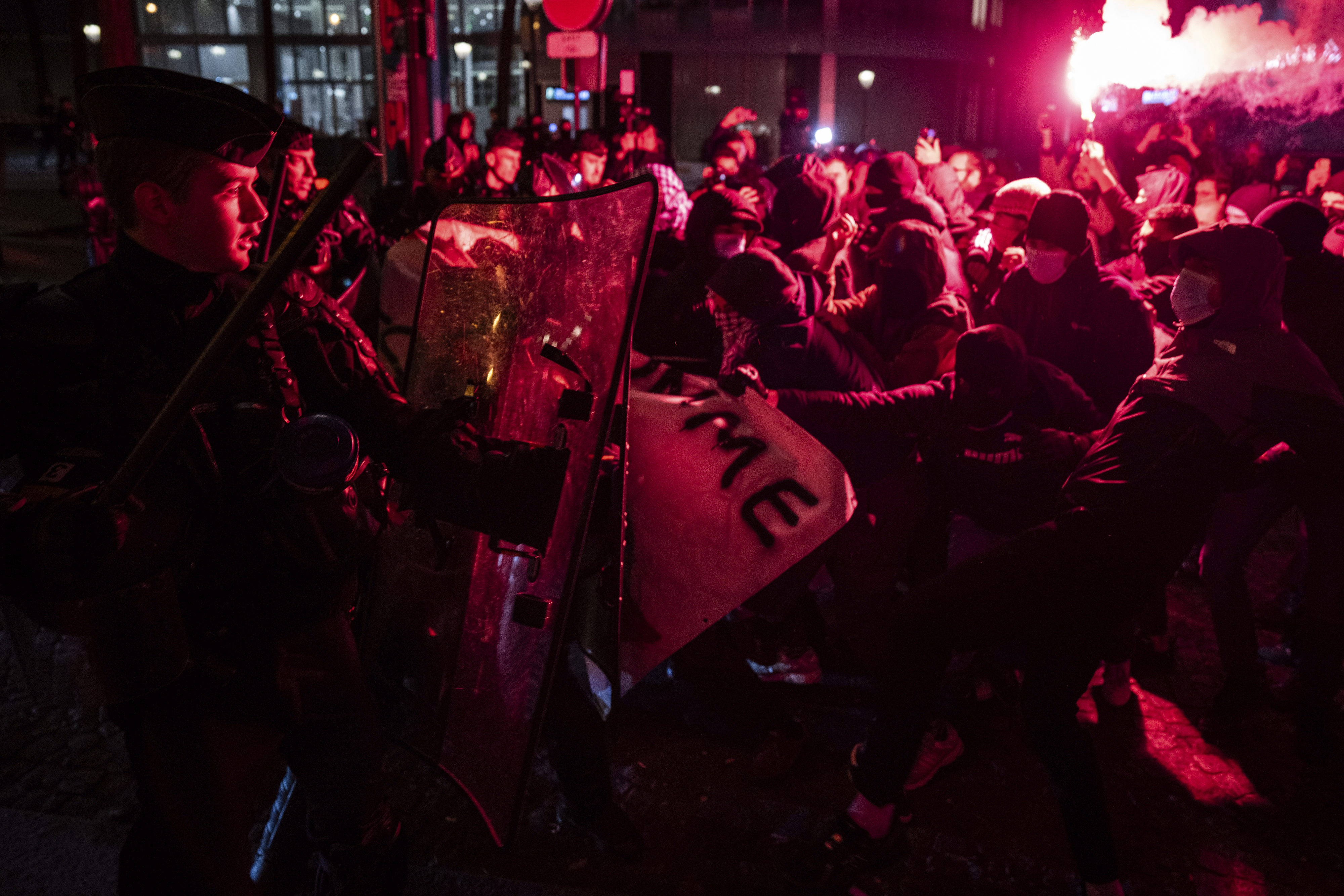 Protestors and police clash during a rally against the "Israel is Forever" gala organized by far-right Franco-Israeli figures, in Paris, Wednesday, Nov. 13, 2024, on the eve of the UEFA Nations League 2025 soccer match between France and Israel. (AP Photo/Louise Delmotte)