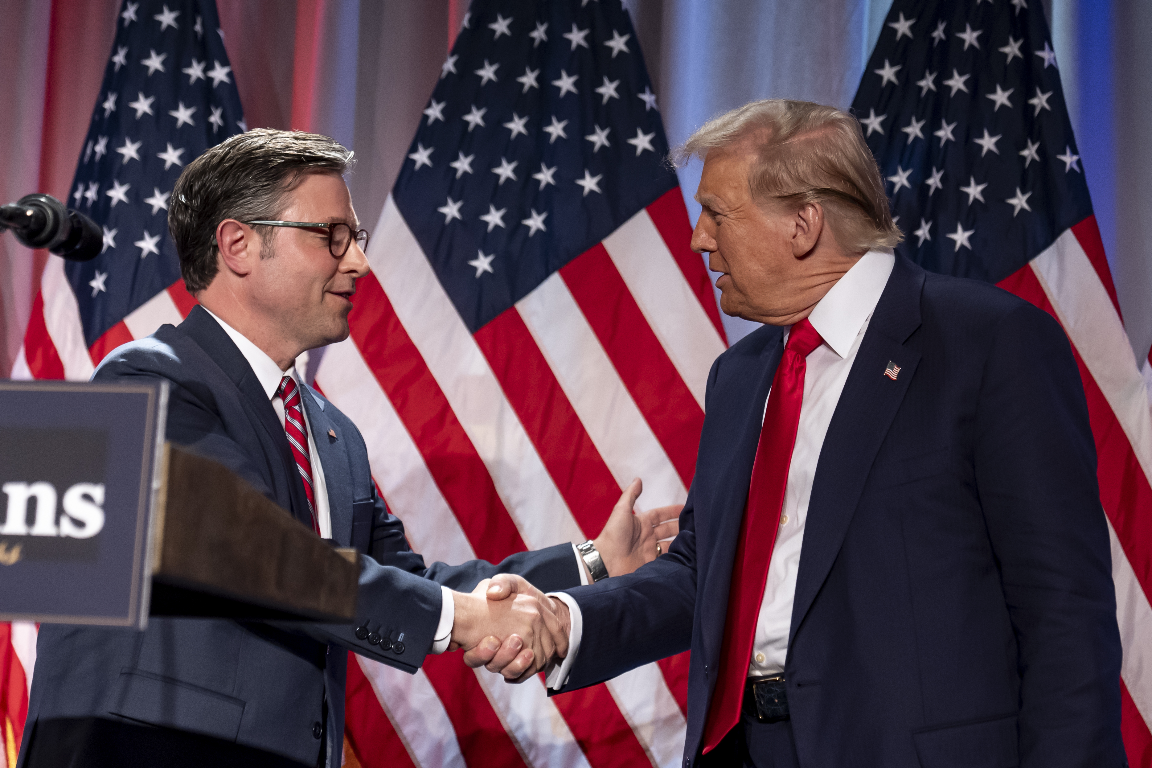 President-elect Donald Trump shakes hands with House Speaker Mike Johnson of La., as he arrives to speak at a meeting with the House GOP conference, Wednesday, Nov. 13, 2024, in Washington. (AP Photo/Alex Brandon)