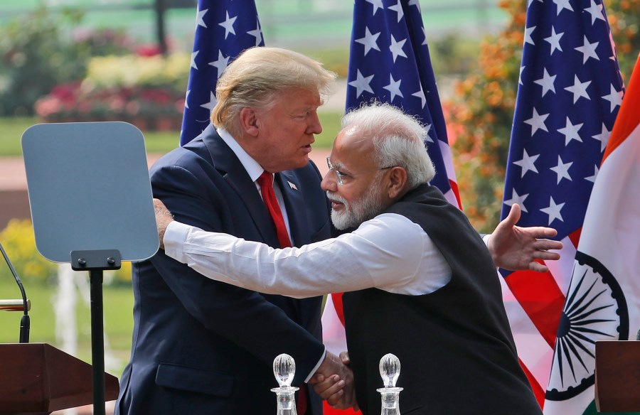 FILE - U.S. President Donald Trump, left and Indian Prime Minister Narendra Modi embrace after giving a joint statement in New Delhi, India, Feb. 25, 2020. (AP Photo/Manish Swarup, File)