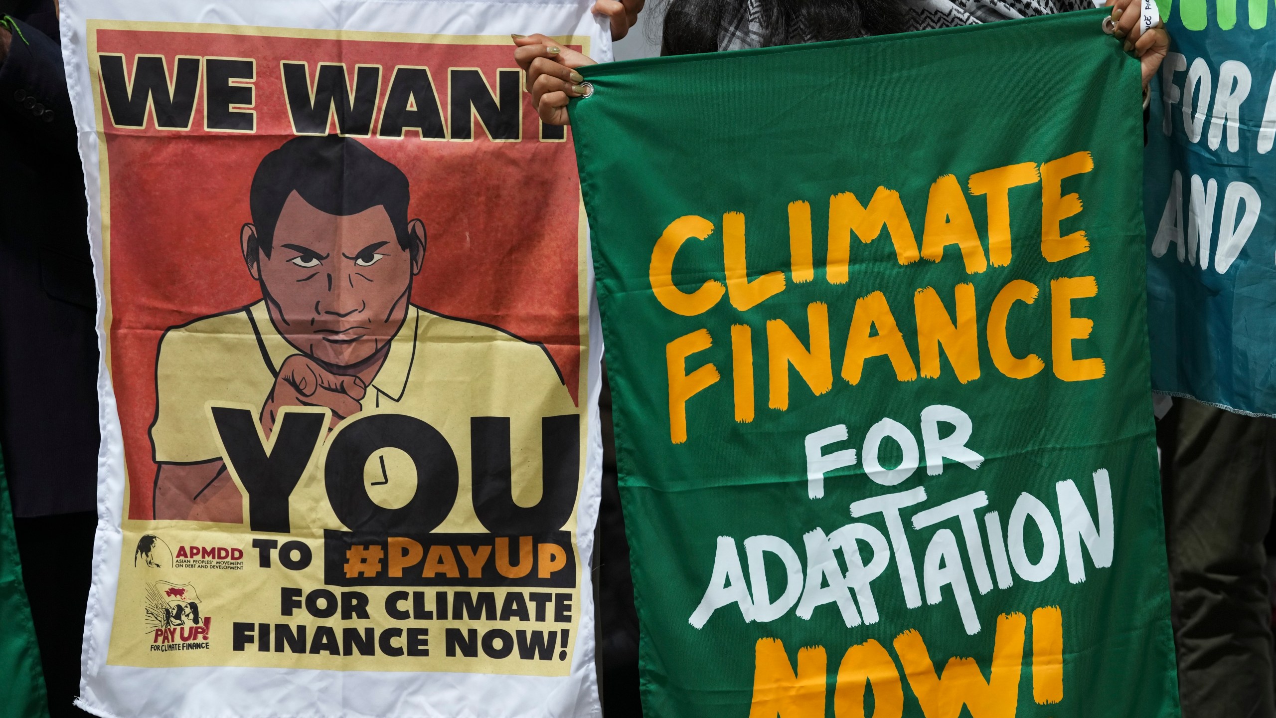 Activists participate in a demonstration for climate finance at the COP29 U.N. Climate Summit, Thursday, Nov. 14, 2024, in Baku, Azerbaijan. (AP Photo/Peter Dejong)