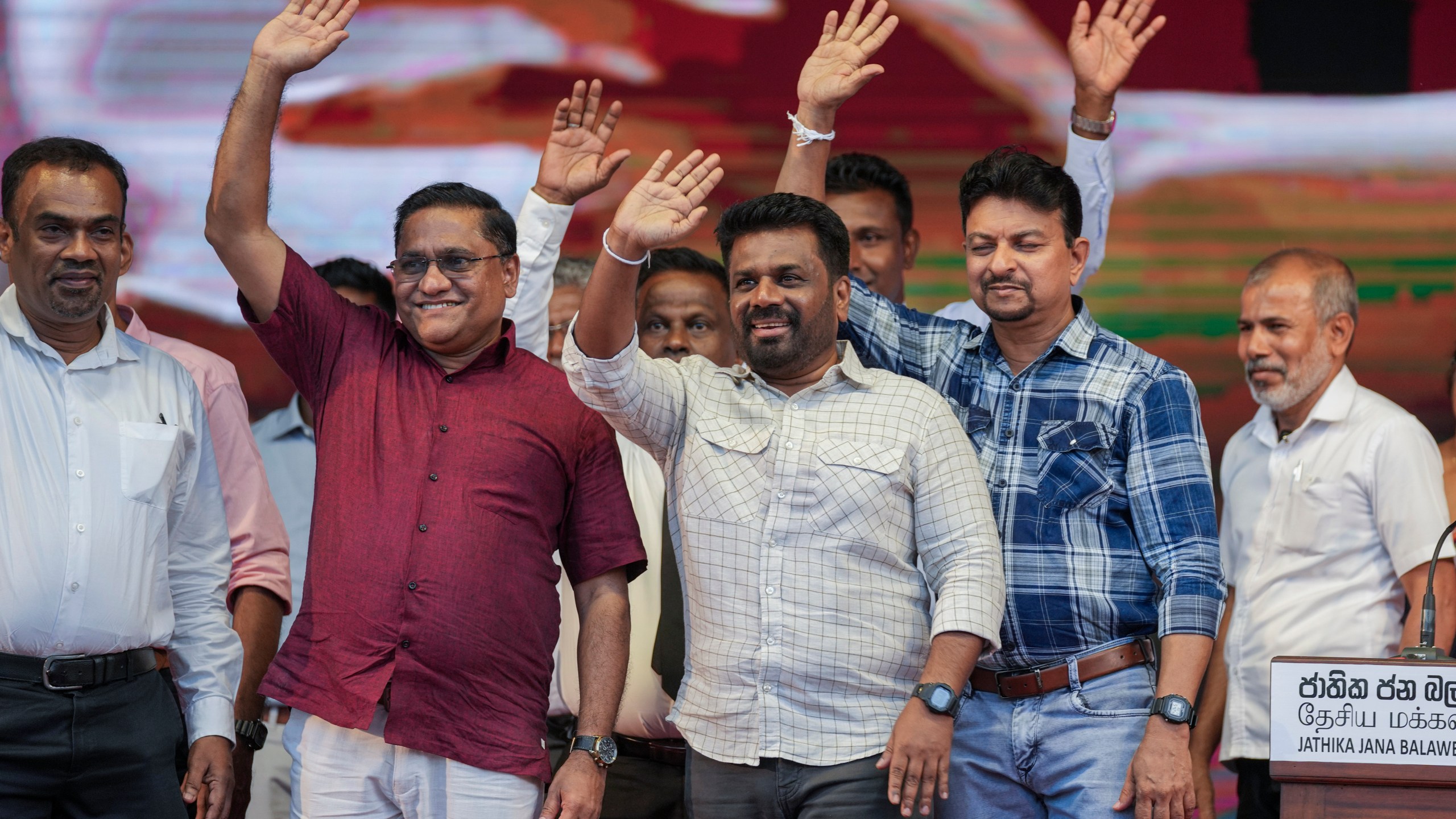 Sri Lankan President Anura Kumara Dissanayake waves with other candidates during a public rally ahead of Thursday's parliamentary election in Gampaha, Sri Lanka, Monday, Nov. 11, 2024. (AP Photo/Eranga Jayawardena)