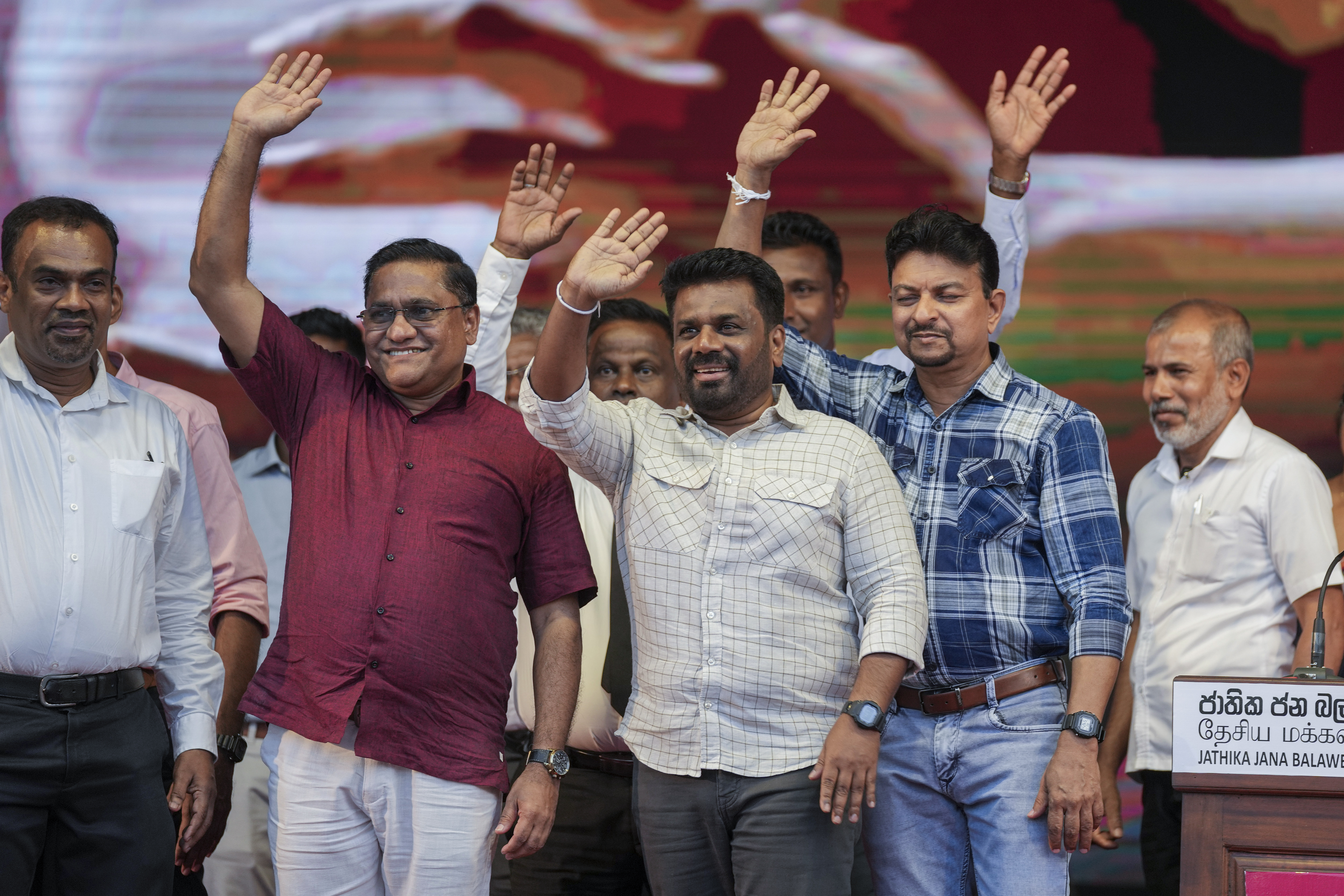 Sri Lankan President Anura Kumara Dissanayake waves with other candidates during a public rally ahead of Thursday's parliamentary election in Gampaha, Sri Lanka, Monday, Nov. 11, 2024. (AP Photo/Eranga Jayawardena)