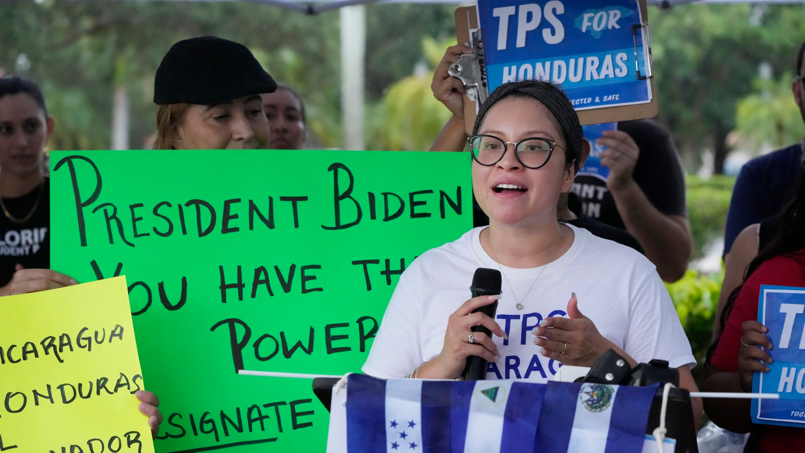 FILE - Yareliz Mendez, 29, with the Florida Immigrant Coalition, speaks during a news conference calling for a new designation of Temporary Protected Status (TPS) for migrants from Nicaragua, El Salvador, and Honduras, in front of the Immigration and Customs Enforcement (ICE) offices, Wednesday, July 26, 2023, in Miramar, Fla. (AP Photo/Wilfredo Lee, File)