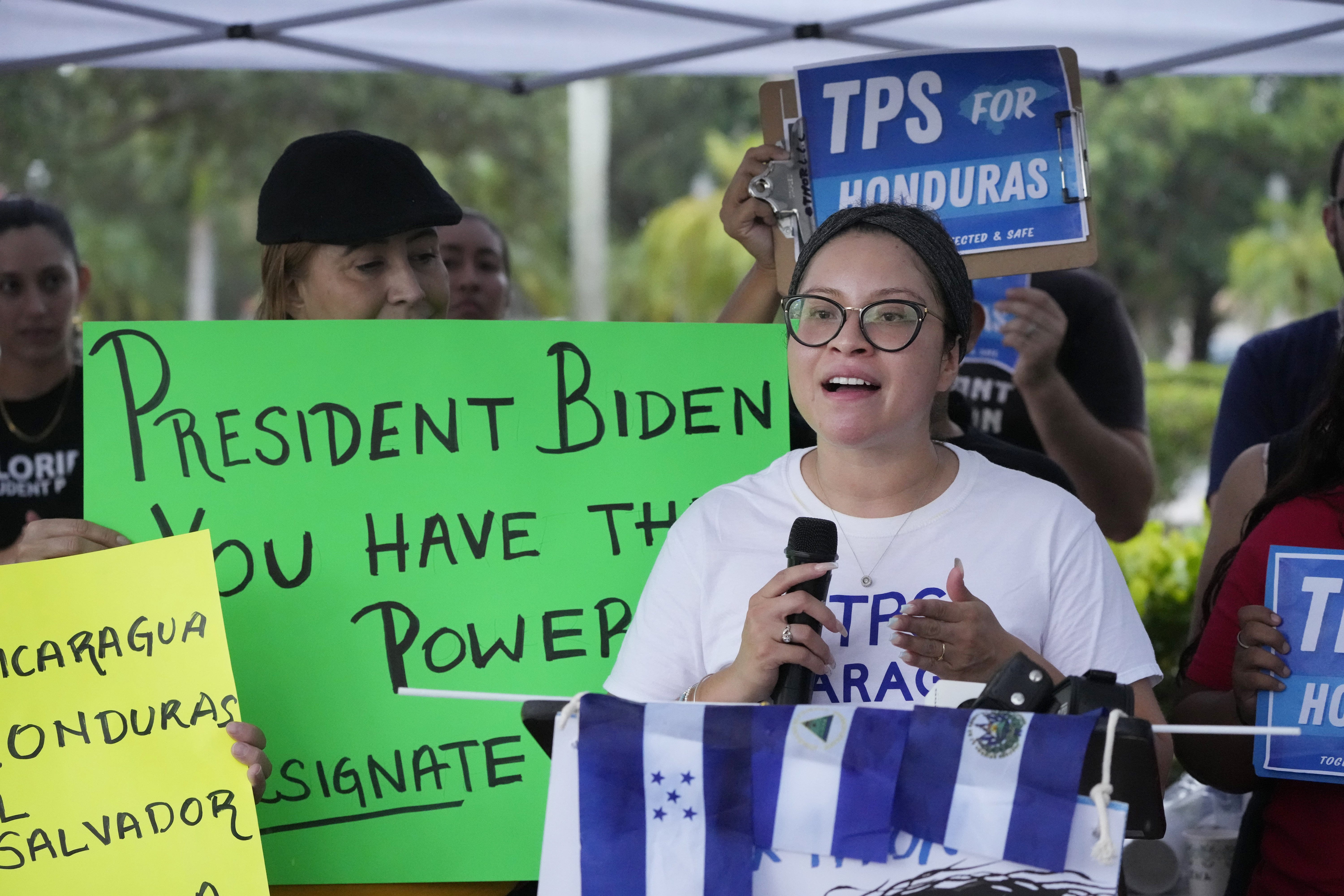 FILE - Yareliz Mendez, 29, with the Florida Immigrant Coalition, speaks during a news conference calling for a new designation of Temporary Protected Status (TPS) for migrants from Nicaragua, El Salvador, and Honduras, in front of the Immigration and Customs Enforcement (ICE) offices, Wednesday, July 26, 2023, in Miramar, Fla. (AP Photo/Wilfredo Lee, File)