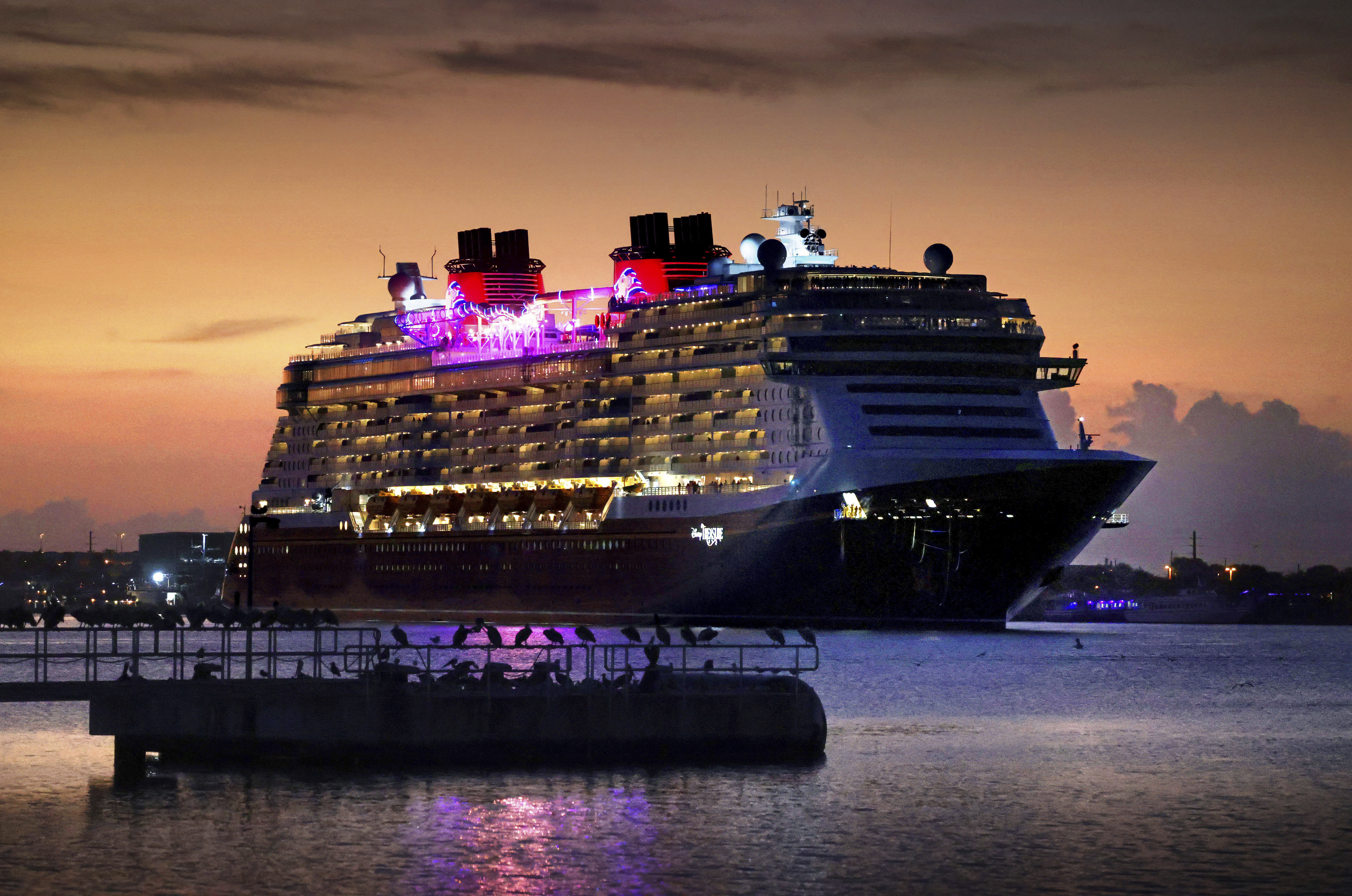 Disney Cruise Line's newest ship, The Treasure, arrives at dawn Port Canaveral, Fla., Tuesday, Nov. 12, 2024. (Joe Burbank/Orlando Sentinel via AP)