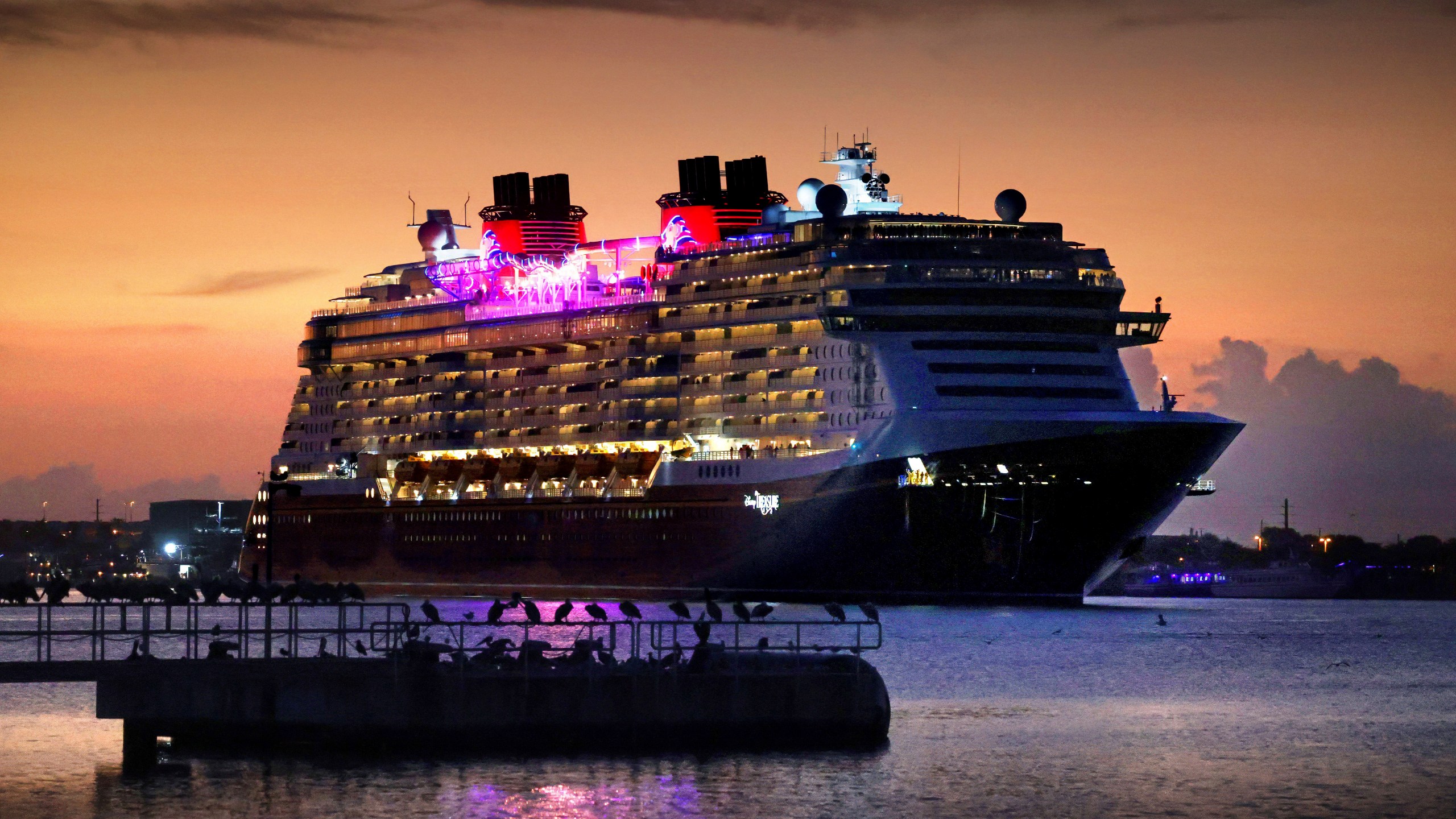 Disney Cruise Line's newest ship, The Treasure, arrives at dawn Port Canaveral, Fla., Tuesday, Nov. 12, 2024. (Joe Burbank/Orlando Sentinel via AP)