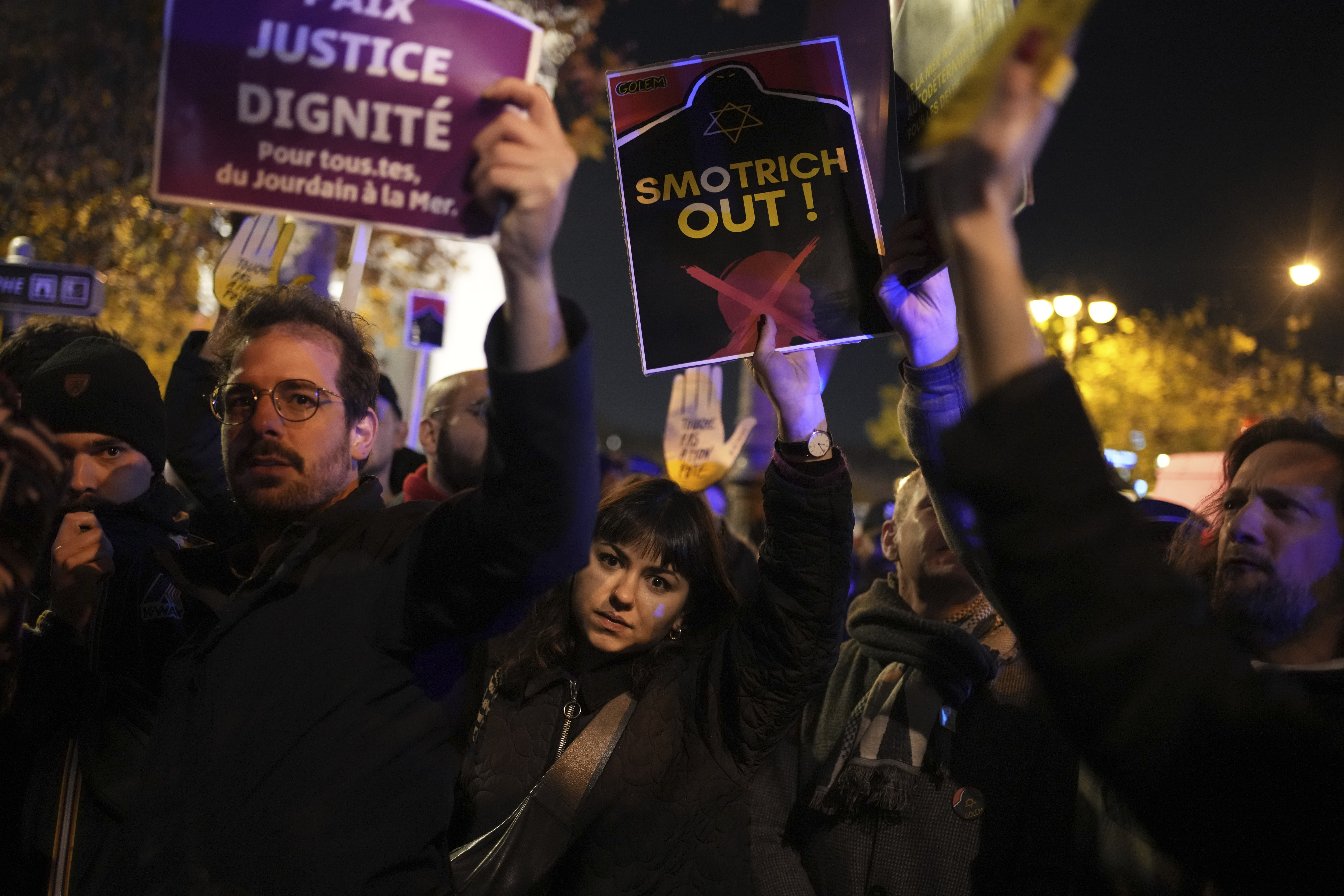 Protesters take part in a rally against the "Israel is Forever" gala organized by far-right Franco-Israeli figures, in Paris, Wednesday, Nov. 13, 2024, on the eve of the UEFA Nations League 2025 soccer match between France and Israel. (AP Photo/Christophe Ena)