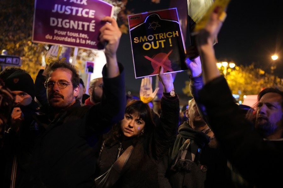 Protesters take part in a rally against the "Israel is Forever" gala organized by far-right Franco-Israeli figures, in Paris, Wednesday, Nov. 13, 2024, on the eve of the UEFA Nations League 2025 soccer match between France and Israel. (AP Photo/Christophe Ena)