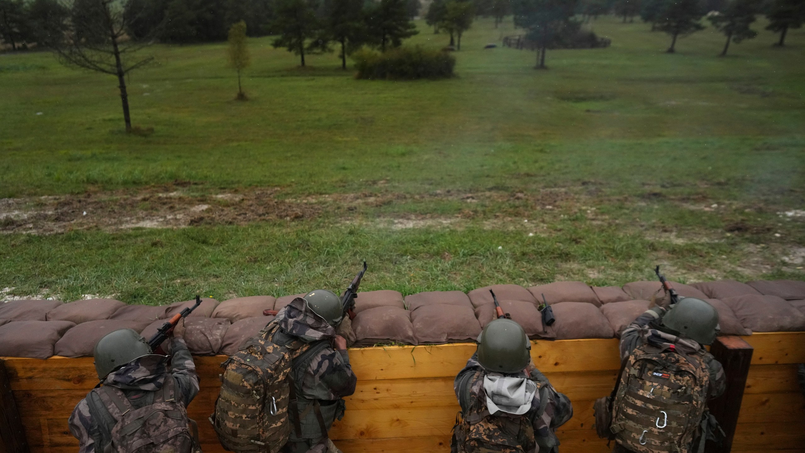 FILE - Ukrainian soldiers train at a military camp in eastern France, Wednesday, Oct. 9, 2024. (AP Photo/Thibault Camus, Pool, File)