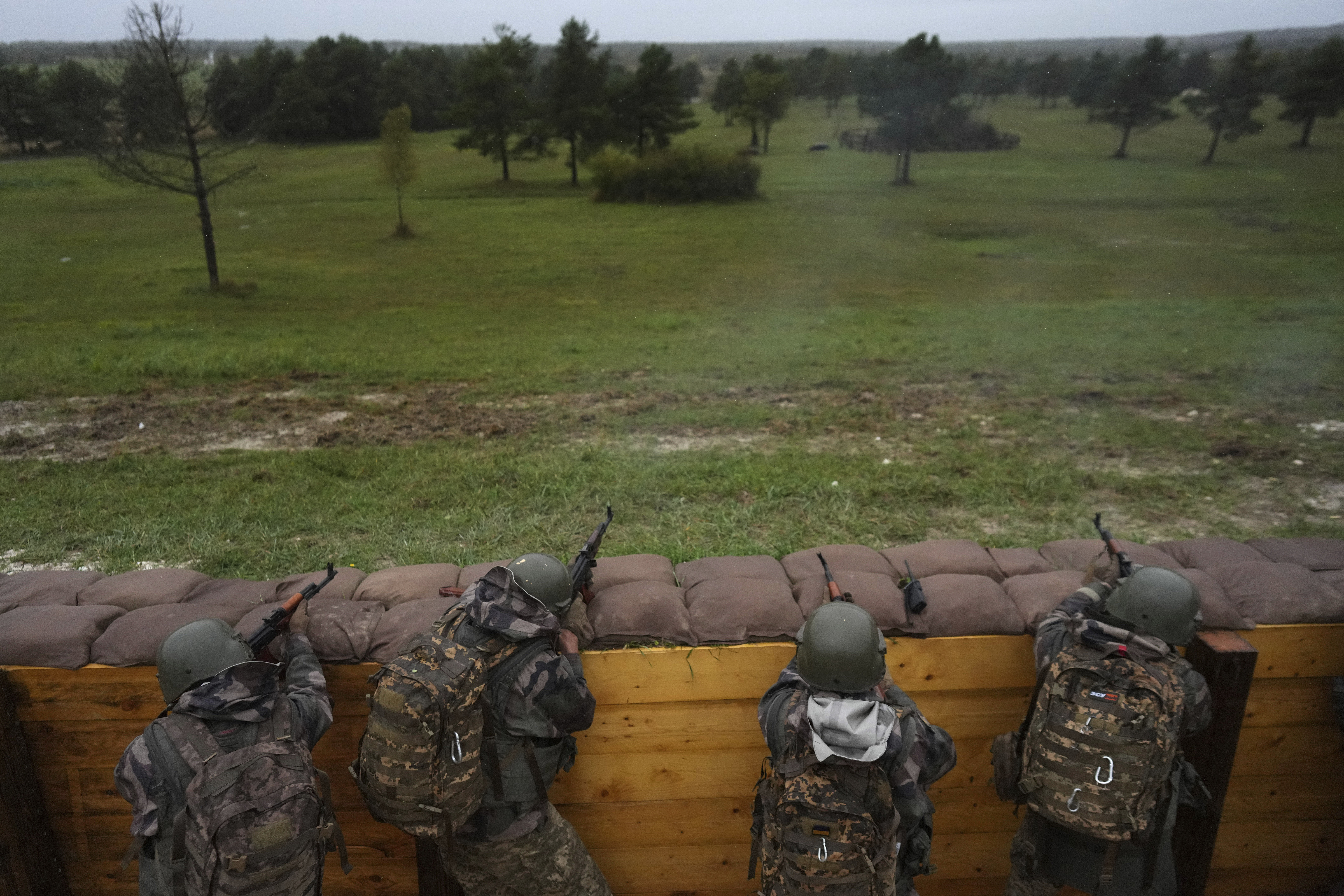 FILE - Ukrainian soldiers train at a military camp in eastern France, Wednesday, Oct. 9, 2024. (AP Photo/Thibault Camus, Pool, File)