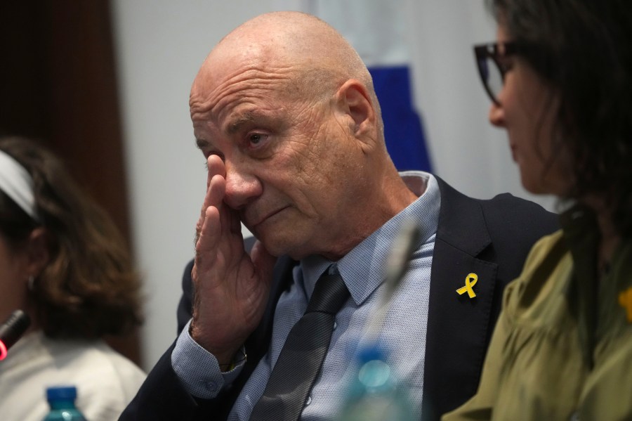 Louis Har, a former Israeli hostage, gets emotional during a press conference in Rome, Thursday, Nov. 14, 2024. (AP Photo/Alessandra Tarantino)