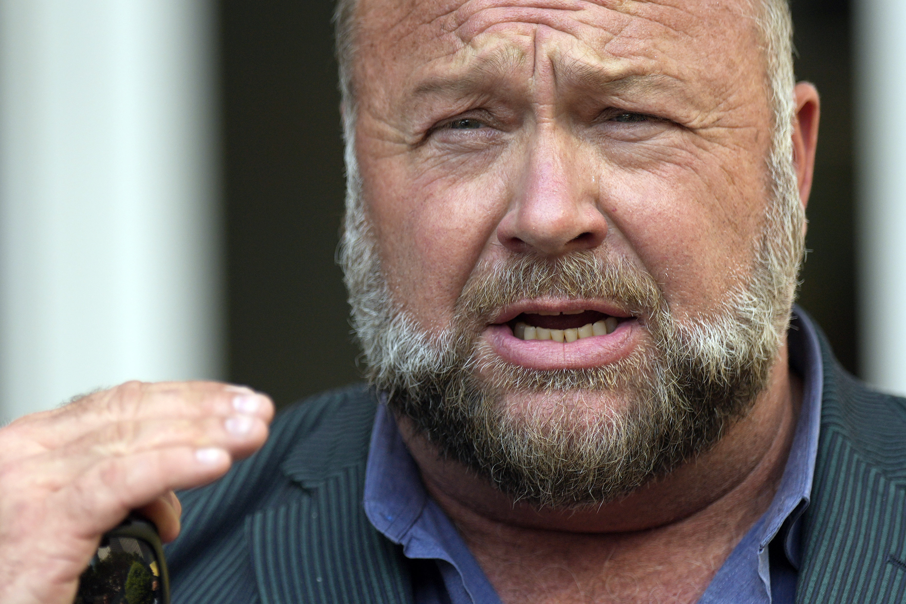 FILE - Right-wing conspiracy theorist Alex Jones speaks outside the federal courthouse after a bankruptcy hearing Friday, June 14, 2024, in Houston. (AP Photo/David J. Phillip, File)