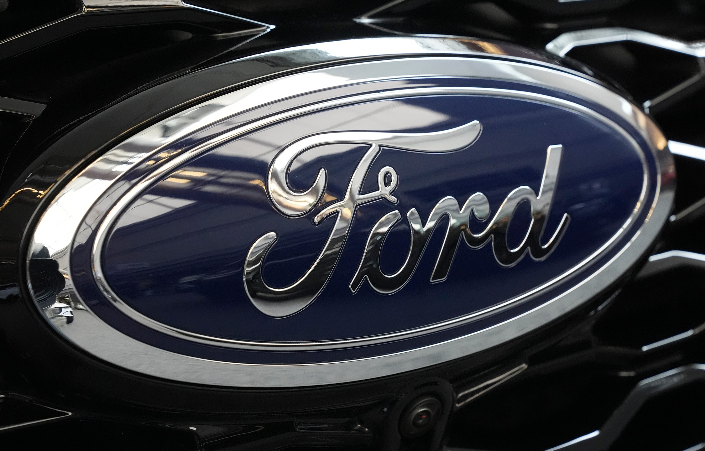 FILE - The Ford logo is seen on the grill of a Ford Explorer on display at the Pittsburgh International Auto Show in Pittsburgh, on Feb. 15, 2024. (AP Photo/Gene J. Puskar, File)