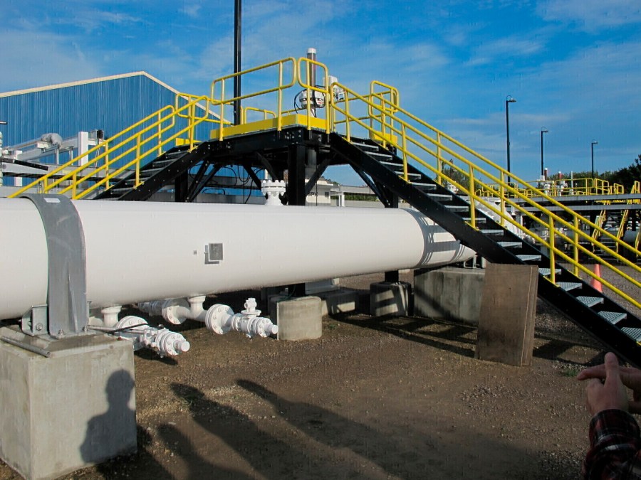 FILE - An above-ground section of Enbridge's Line 5 at the Mackinaw City, Mich., pump station is seen, Oct. 7, 2016. (AP Photo/John Flesher, File)