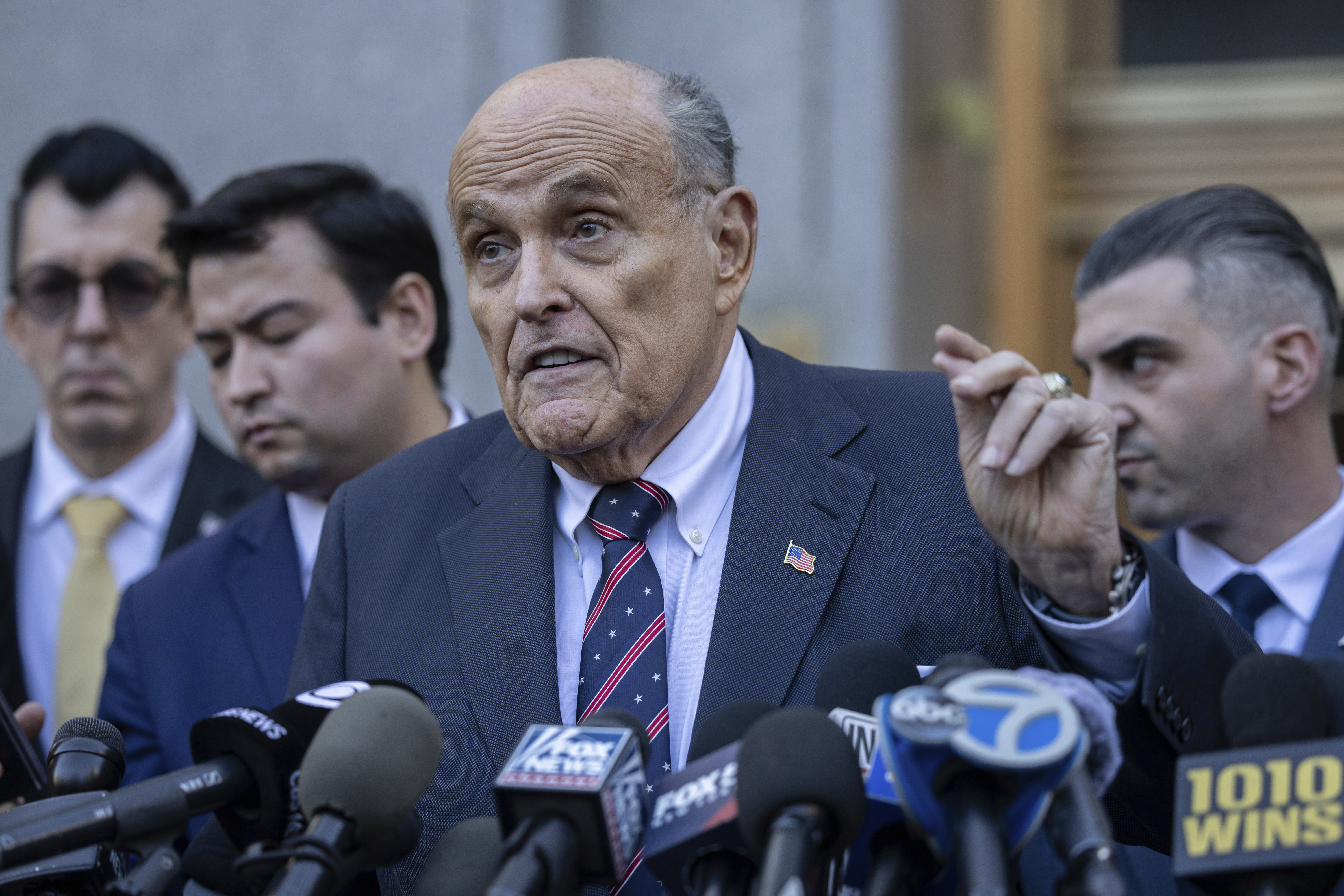 Former New York City Mayor Rudy Giuliani speaks to the members of the media as he leaves court in New York, Thursday, Nov. 7, 2024. (AP Photo/Yuki Iwamura)