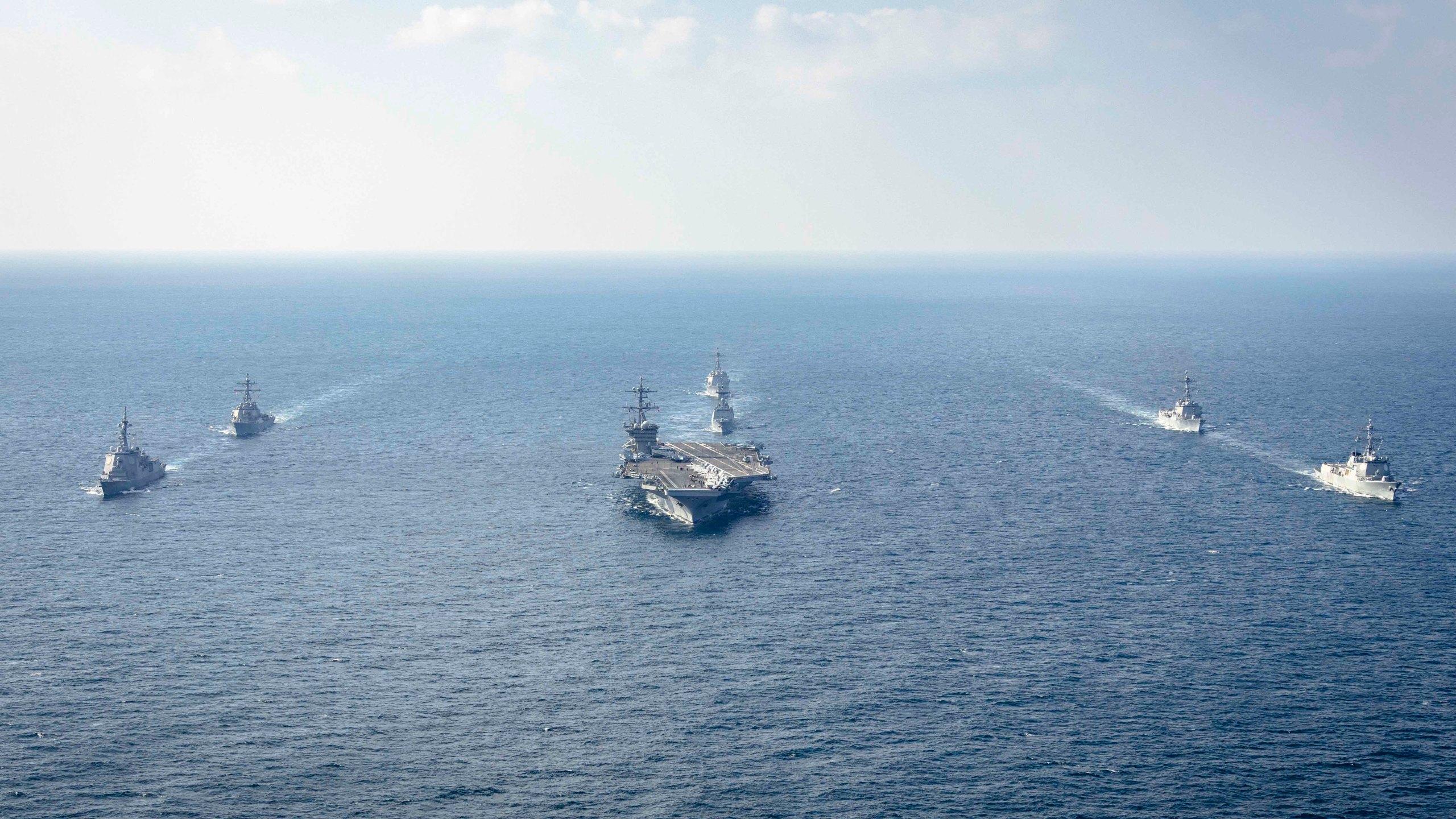 In this photo provided by South Korea Defense Ministry, warships of South Korea, the United States and Japan including the USS George Washington aircraft carrier, bottom center, take part in the trilateral Freedom Edge exercise in international waters off South Korea's southern island of Jeju, Wednesday, Nov. 13, 2024. (South Korea Defense Ministry via AP)