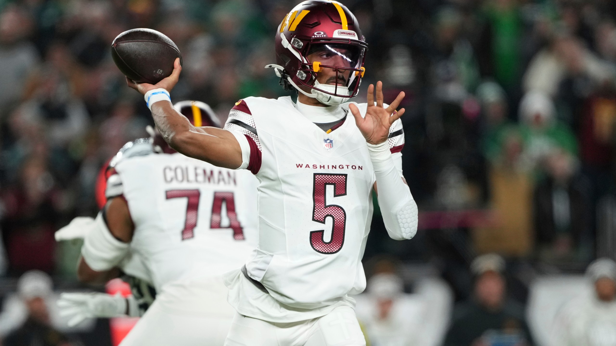 Washington Commanders quarterback Jayden Daniels throws during the first half of an NFL football game against the Philadelphia Eagles Thursday, Nov. 14, 2024, in Philadelphia. (AP Photo/Matt Slocum)