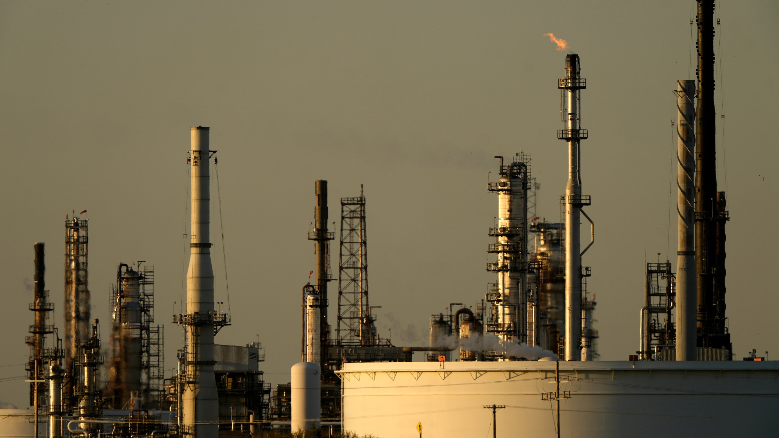 A motorist drives past the CHS oil refinery Saturday, Sept. 28, 2024, in McPherson, Kan. (AP Photo/Charlie Riedel)