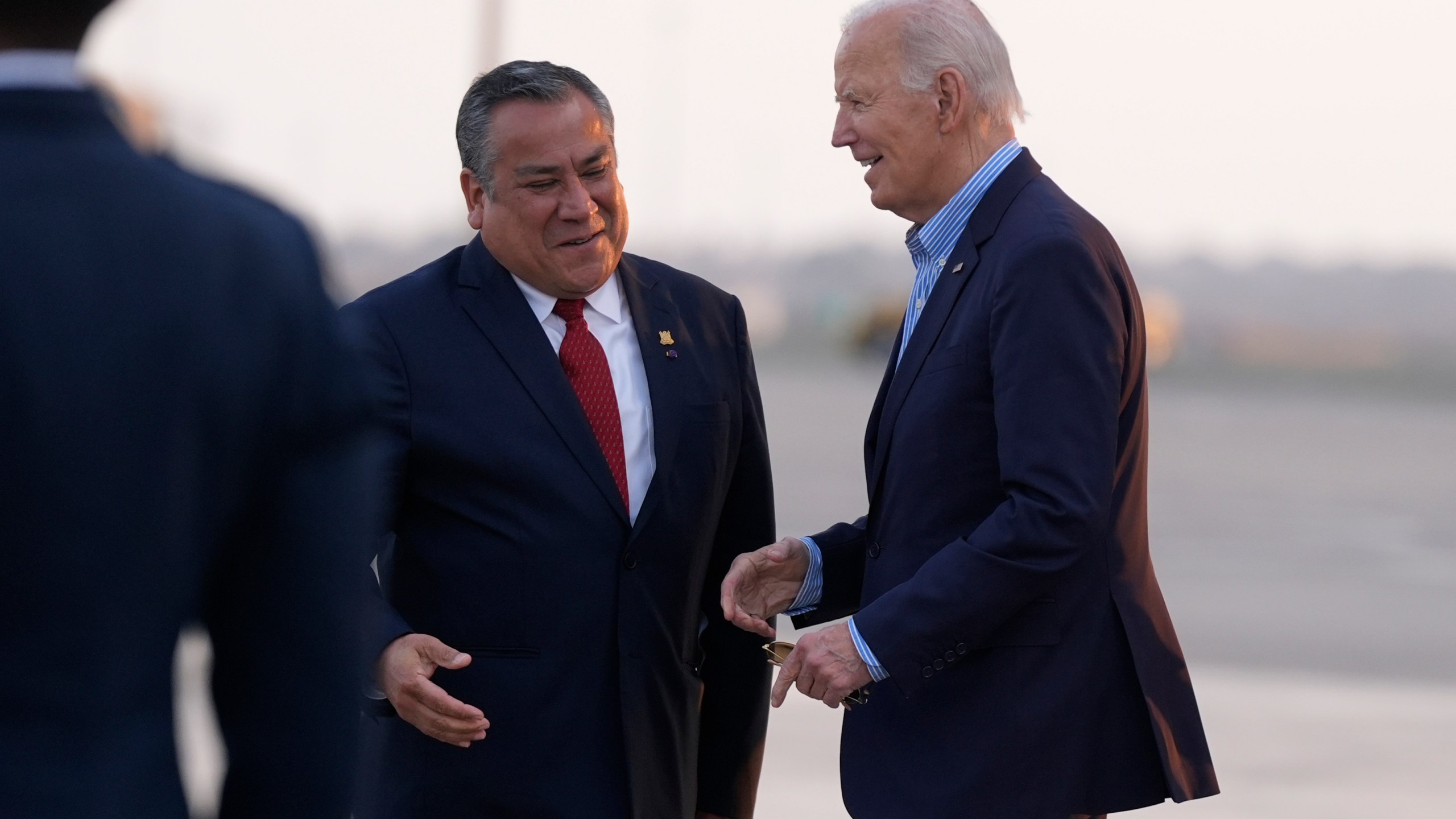 President Joe Biden greets Peru's Prime Minister Gustavo Adrianzen as he arrives at Jorge Chavez International Airport in Lima, Peru, Thursday, Nov. 14, 2024, to attend the APEC Summit. (AP Photo/Manuel Balce Ceneta)