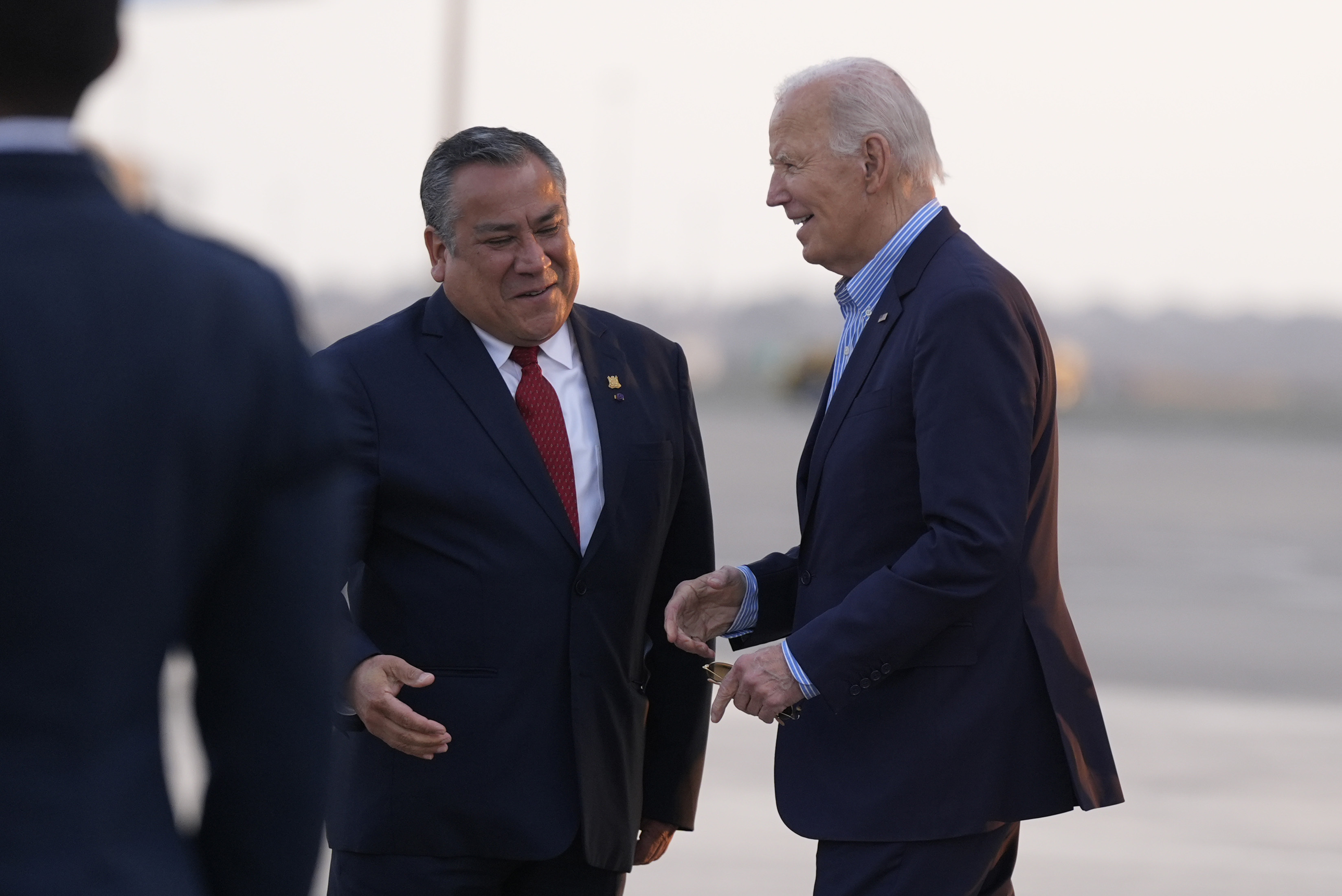 President Joe Biden greets Peru's Prime Minister Gustavo Adrianzen as he arrives at Jorge Chavez International Airport in Lima, Peru, Thursday, Nov. 14, 2024, to attend the APEC Summit. (AP Photo/Manuel Balce Ceneta)