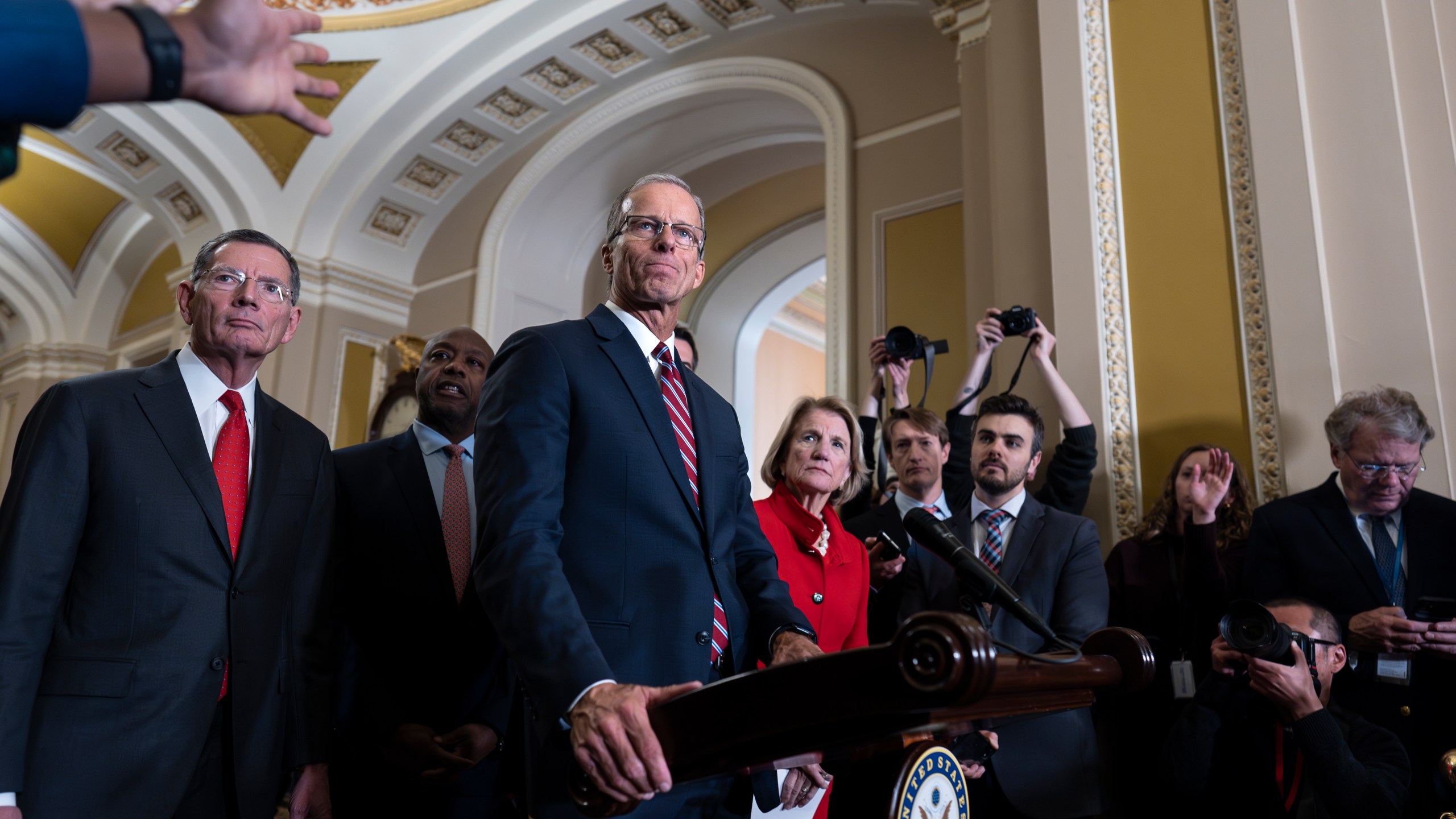 Senate Minority Whip John Thune, R-S.D., joined at left by Sen. John Barrasso, R-Wyo., meets with reporters after he was elected to succeed longtime GOP leader Mitch McConnell of Kentucky, at the Capitol in Washington, Wednesday, Nov. 13, 2024. (AP Photo/J. Scott Applewhite)