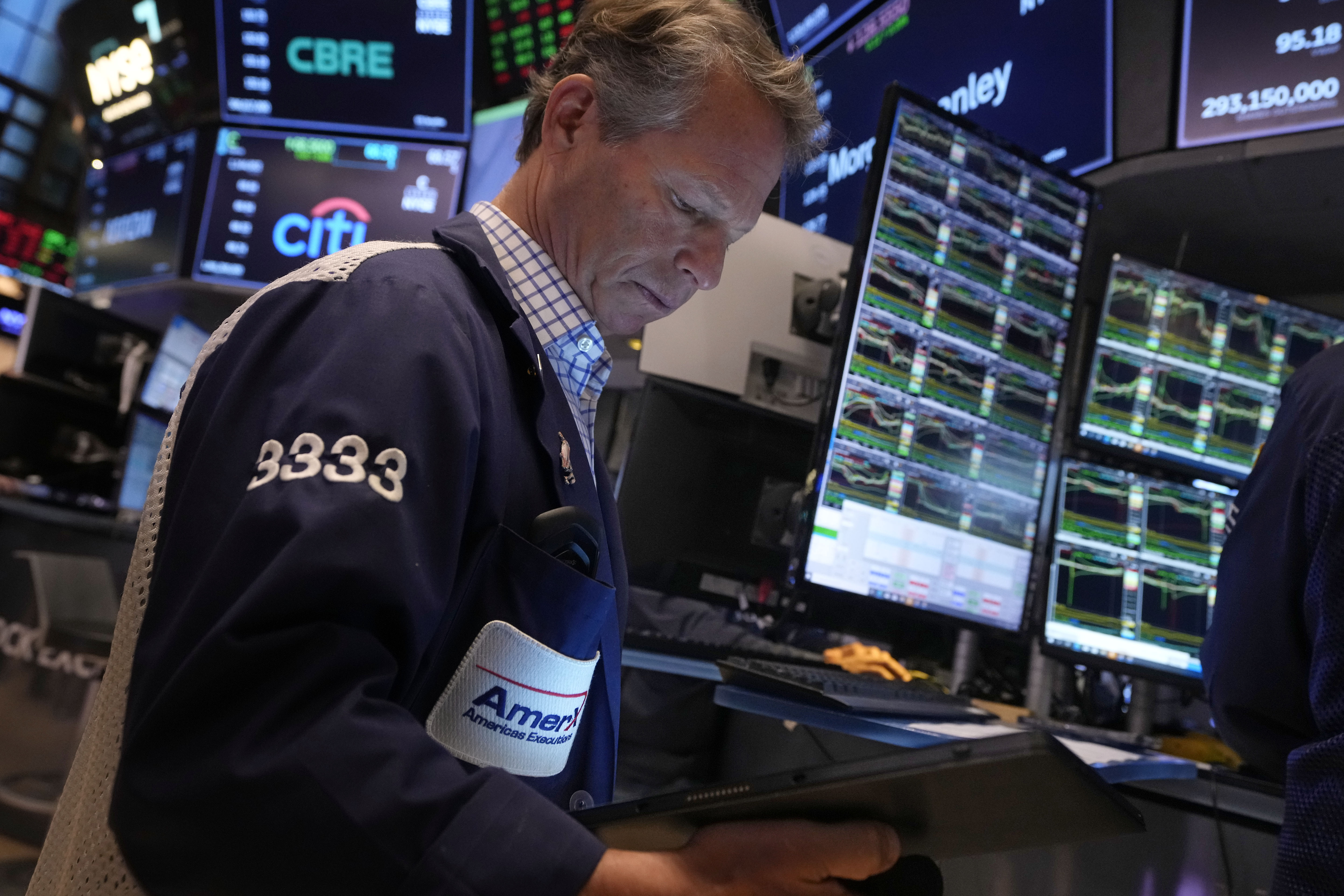 Trader Robert Charmak works on the floor of the New York Stock Exchange, Friday, Nov. 8, 2024. (AP Photo/Richard Drew)