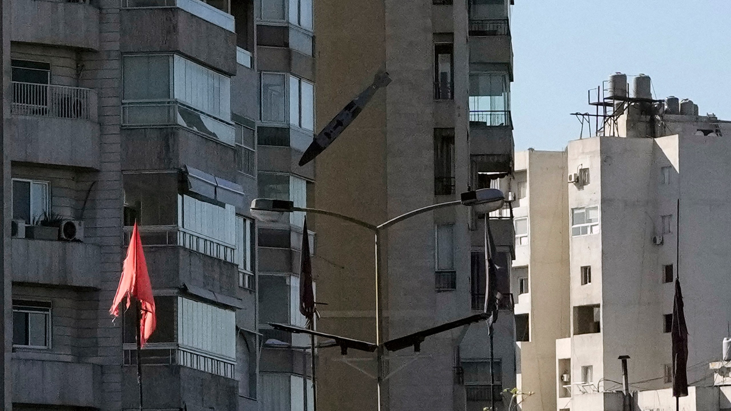 A bomb dropped from an Israeli jet hits a building in Tayouneh, Beirut, Lebanon, Friday, Nov. 15, 2024. (AP Photo/Hassan Ammar)