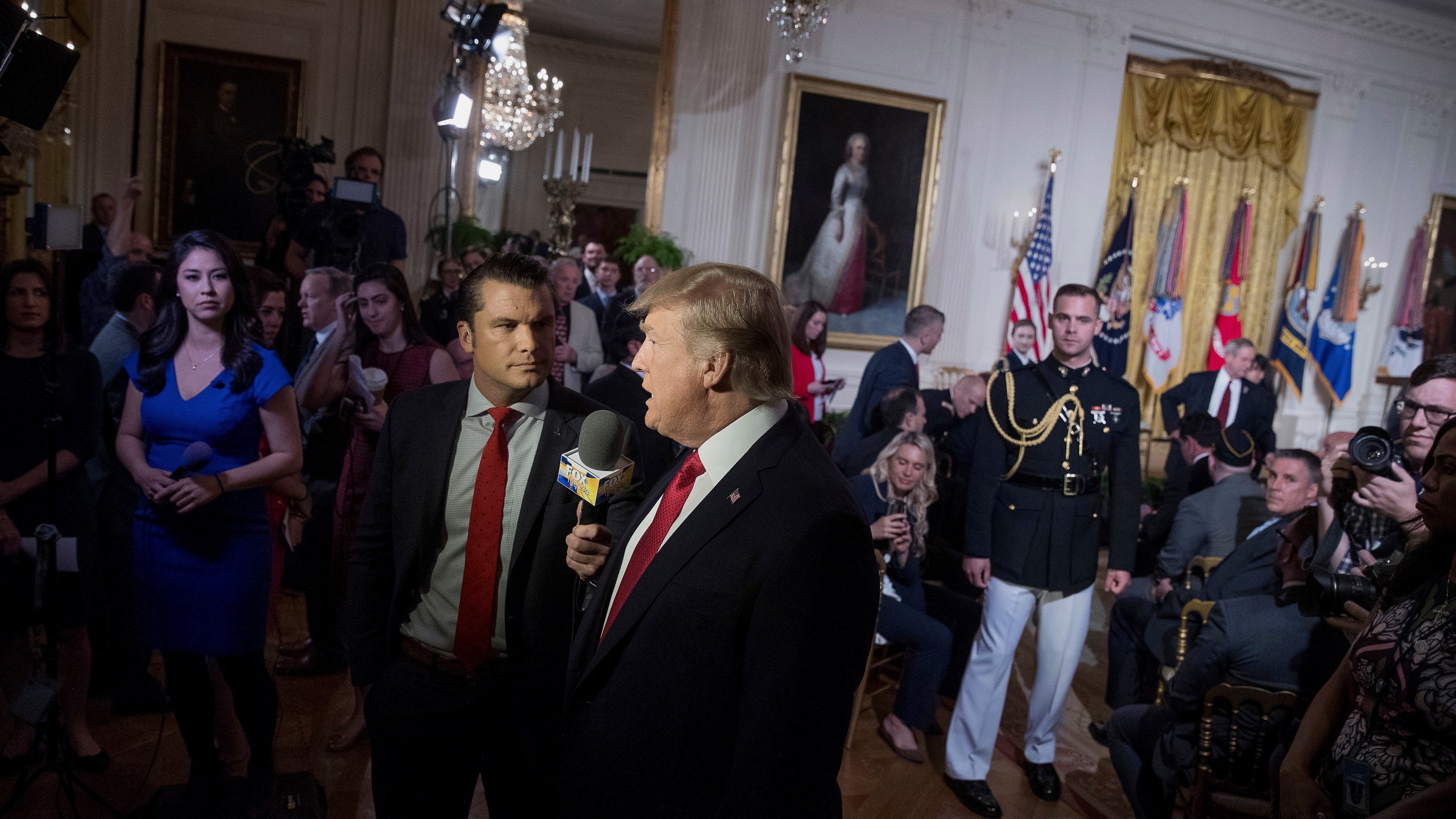 FILE - President Donald Trump appears on Fox & Friends co-host Pete Hegseth at a Wounded Warrior Project Soldier Ride event in the East Room of the White House in Washington, Thursday, April 6, 2017. (AP Photo/Andrew Harnik, File)