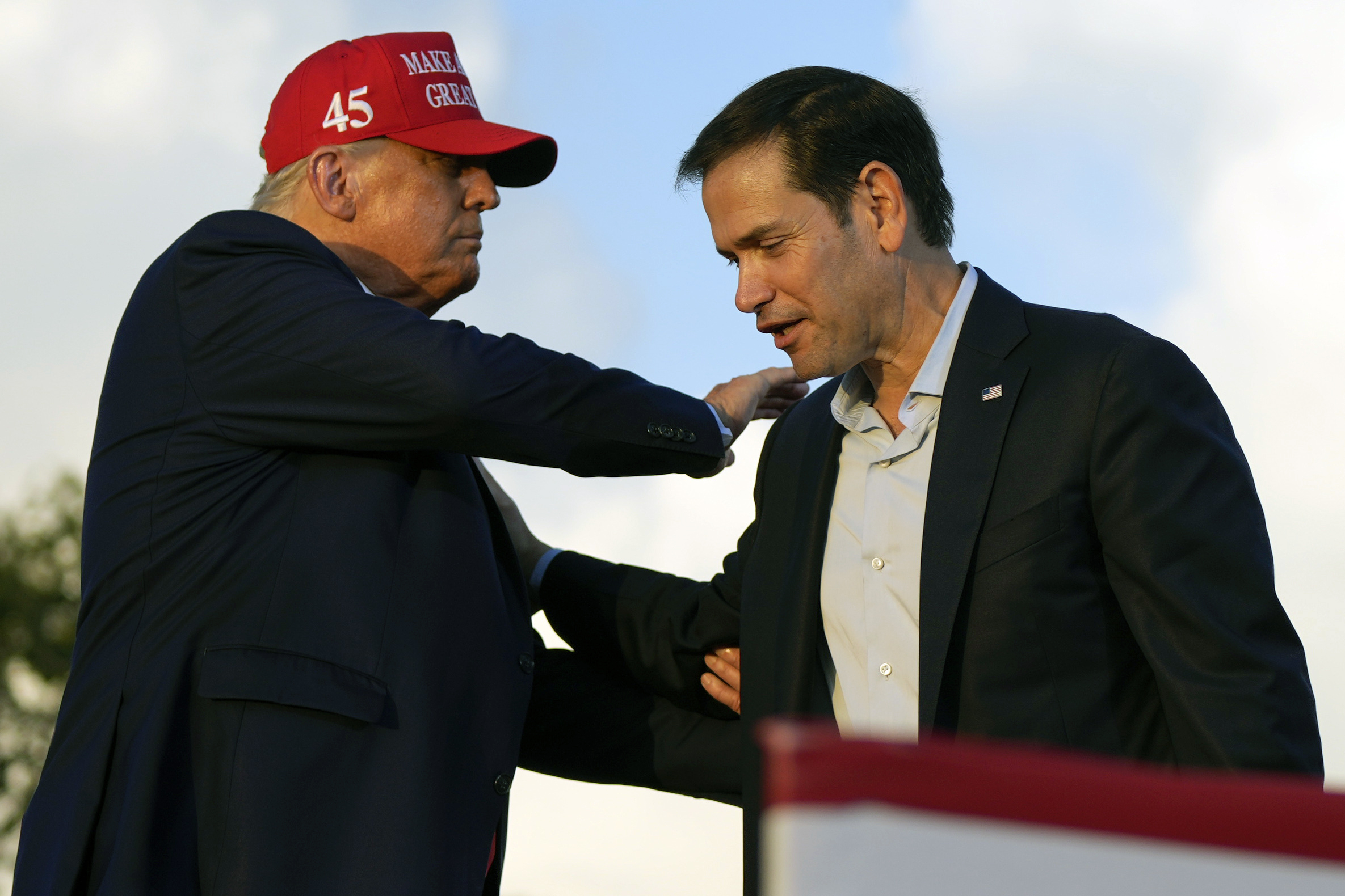 FILE - Then former President Donald Trump pats Sen. Marco Rubio, R-Fla., on the shoulder during a campaign rally at the Miami-Dade County Fair and Exposition in Miami, Nov. 6, 2022. (AP Photo/Rebecca Blackwell, File)