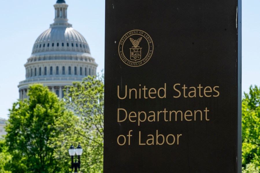 FILE - The entrance to the Labor Department is seen near the Capitol in Washington, Thursday, May 7, 2020. (AP Photo/J. Scott Applewhite, File)