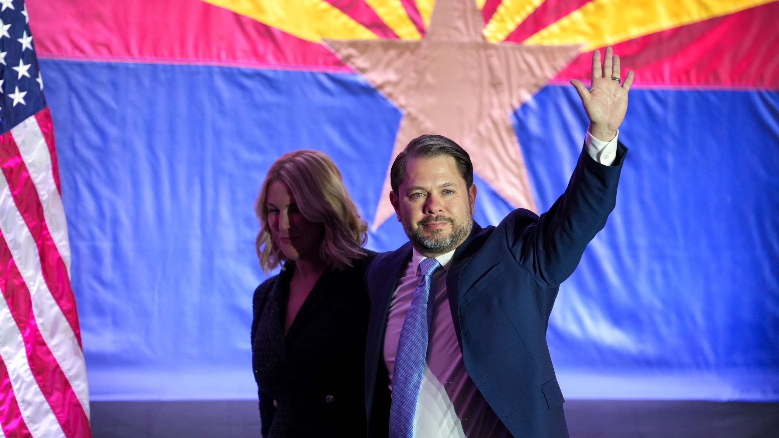 Arizona Democratic Senate candidate Rep. Ruben Gallego, D-Ariz., waves to the crowd as he leaves the stage his wife Sydney Gallego after speaking during a watch party on election night Tuesday, Nov. 5, 2024, in Phoenix. (AP Photo/Ross D. Franklin)