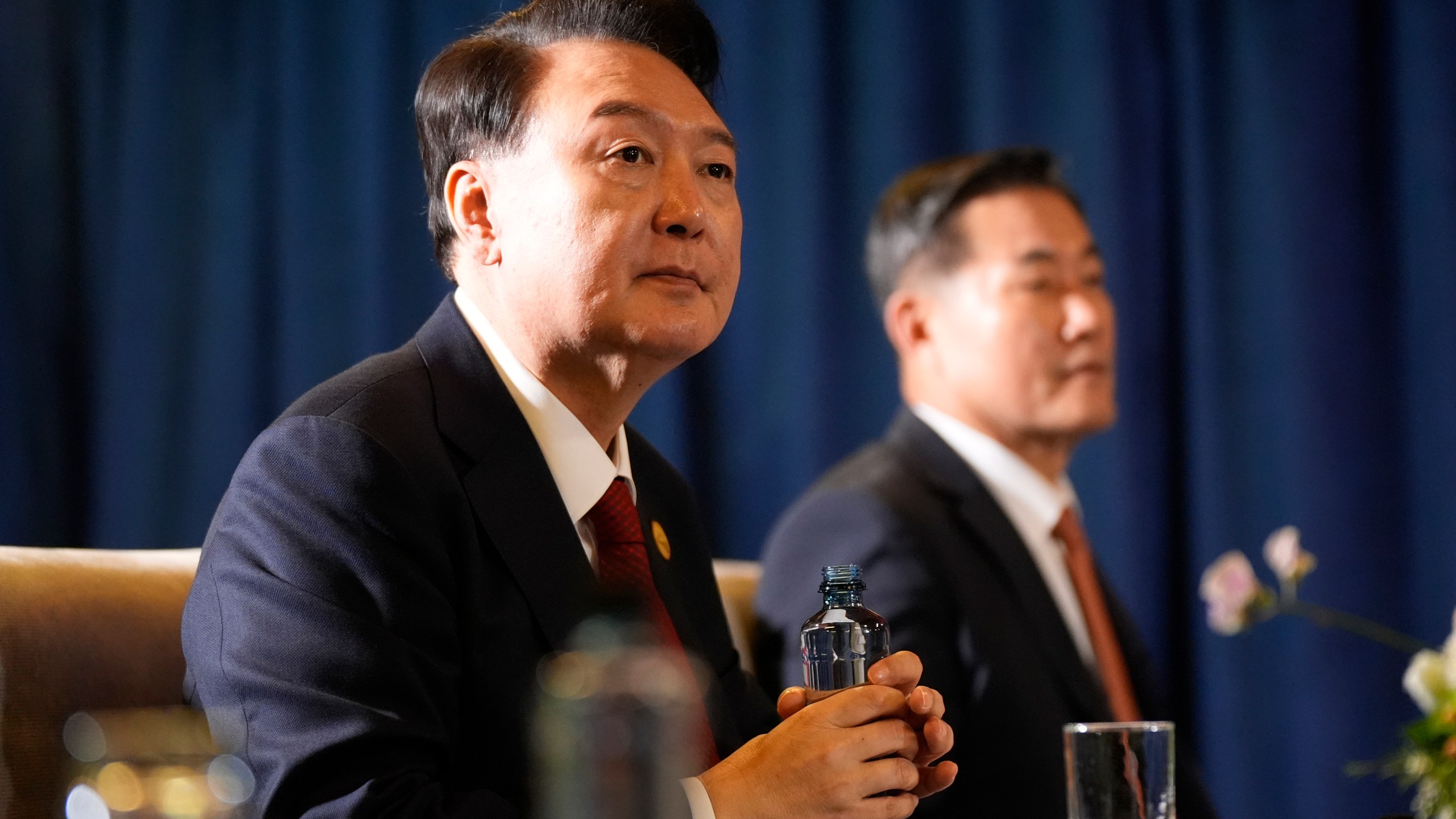 President of South Korea Yoon Suk Yeol listens during a trilateral meeting with President Joe Biden and the Prime Minister of Japan Shigeru Ishiba in Lima, Peru, Friday, Nov. 15, 2024. (AP Photo/Manuel Balce Ceneta)