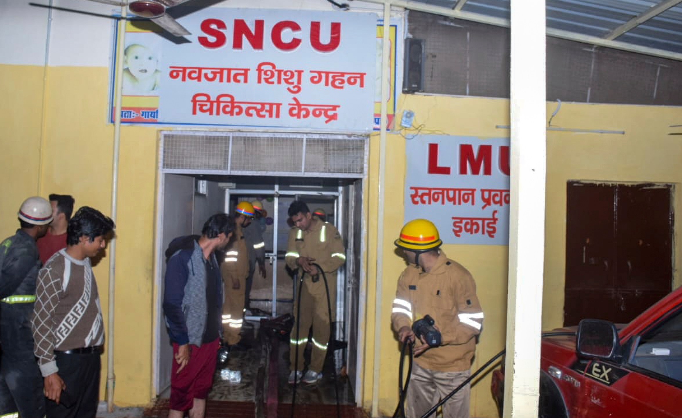 Firefighters work after a fire broke out in a neonatal intensive care unit at Jhansi Medical College hospital, in Jhansi, India, Friday, Nov. 15, 2024. (AP Photo)