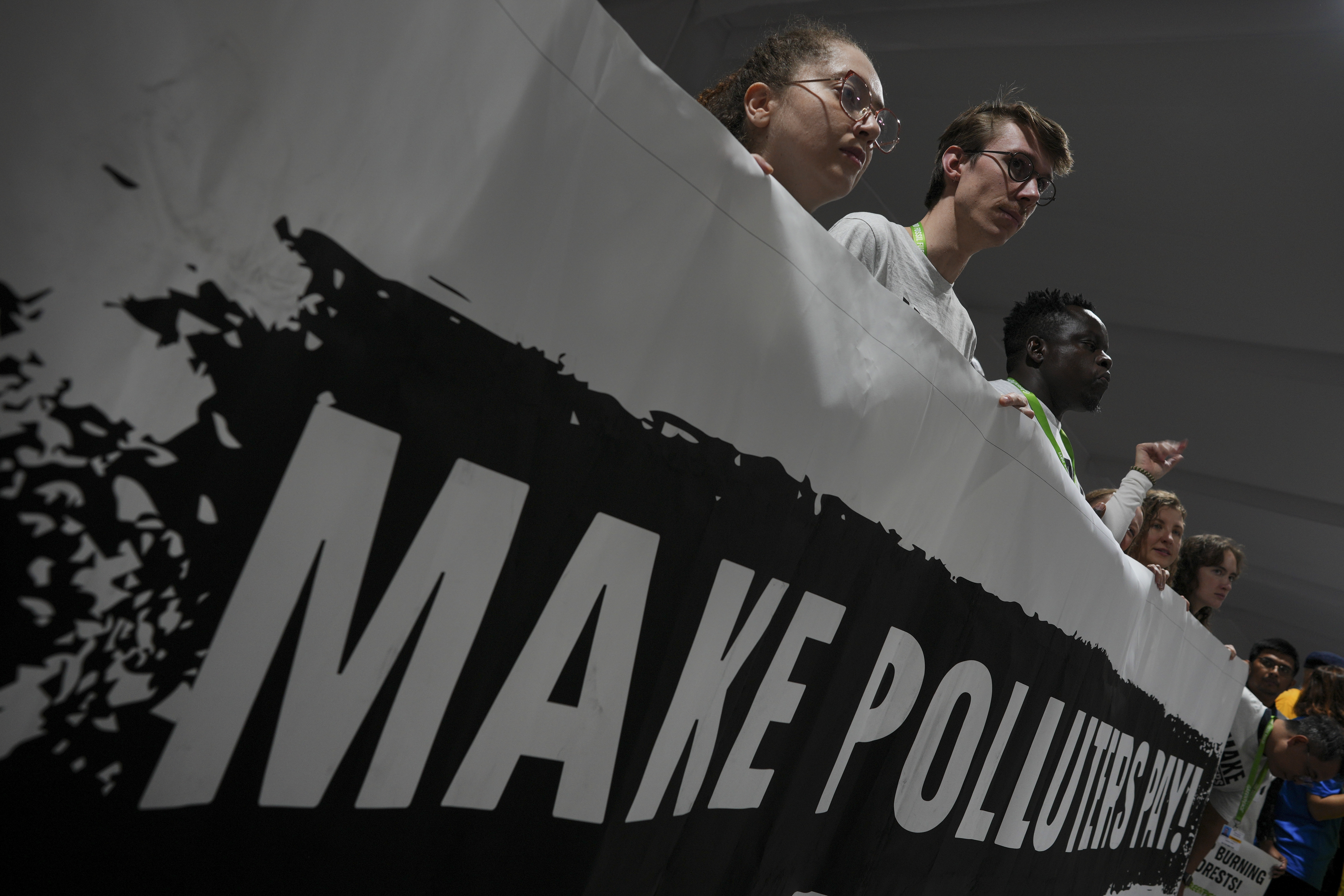 Activists participate in a demonstration for climate finance at the COP29 U.N. Climate Summit, Saturday, Nov. 16, 2024, in Baku, Azerbaijan. (AP Photo/Peter Dejong)