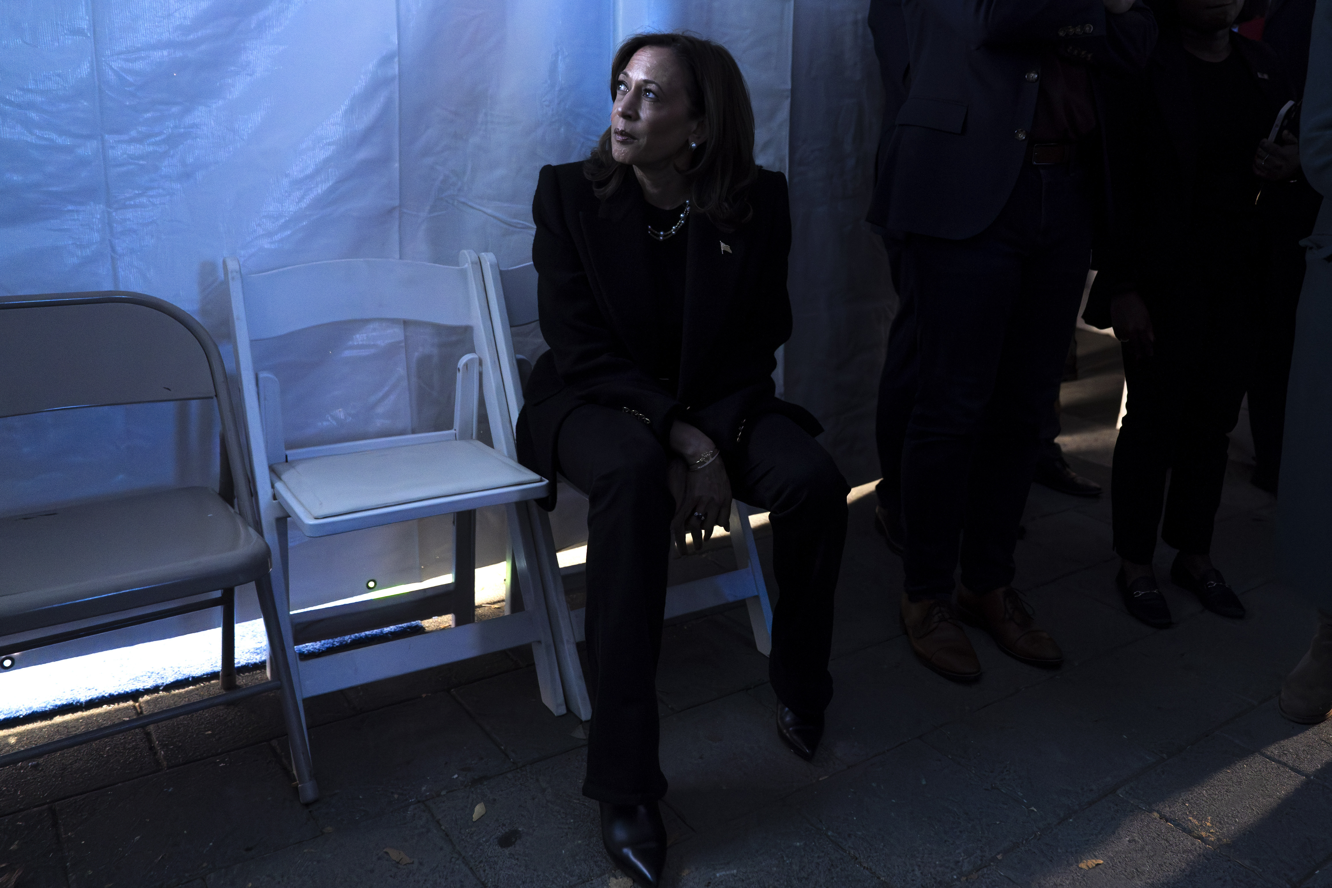 Democratic presidential nominee Vice President Kamala Harris looks at a monitor of the event from backstage, just before taking the stage for her final campaign rally, Monday, Nov. 4, 2024, in Philadelphia. (AP Photo/Jacquelyn Martin)