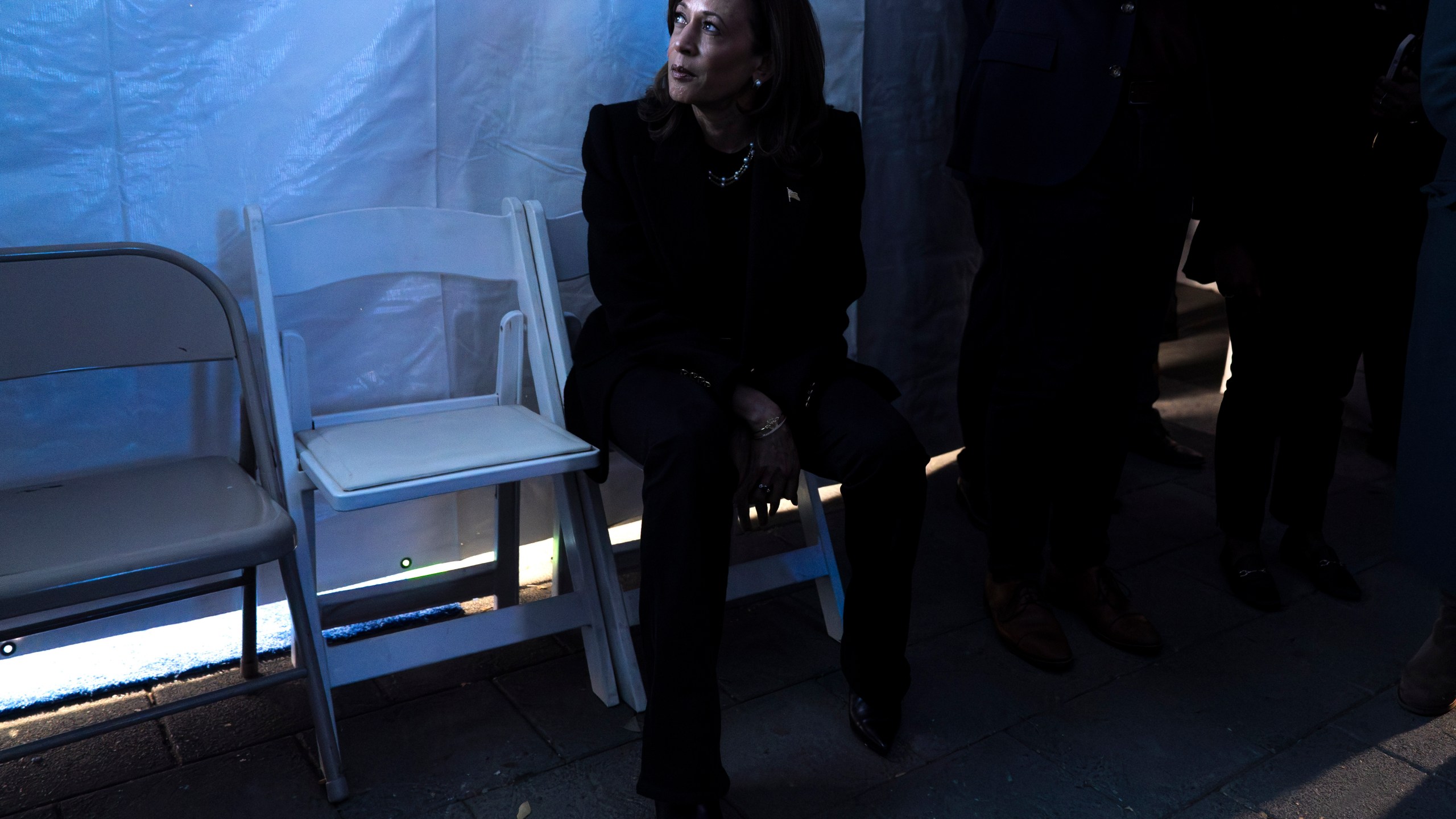 Democratic presidential nominee Vice President Kamala Harris looks at a monitor of the event from backstage, just before taking the stage for her final campaign rally, Monday, Nov. 4, 2024, in Philadelphia. (AP Photo/Jacquelyn Martin)