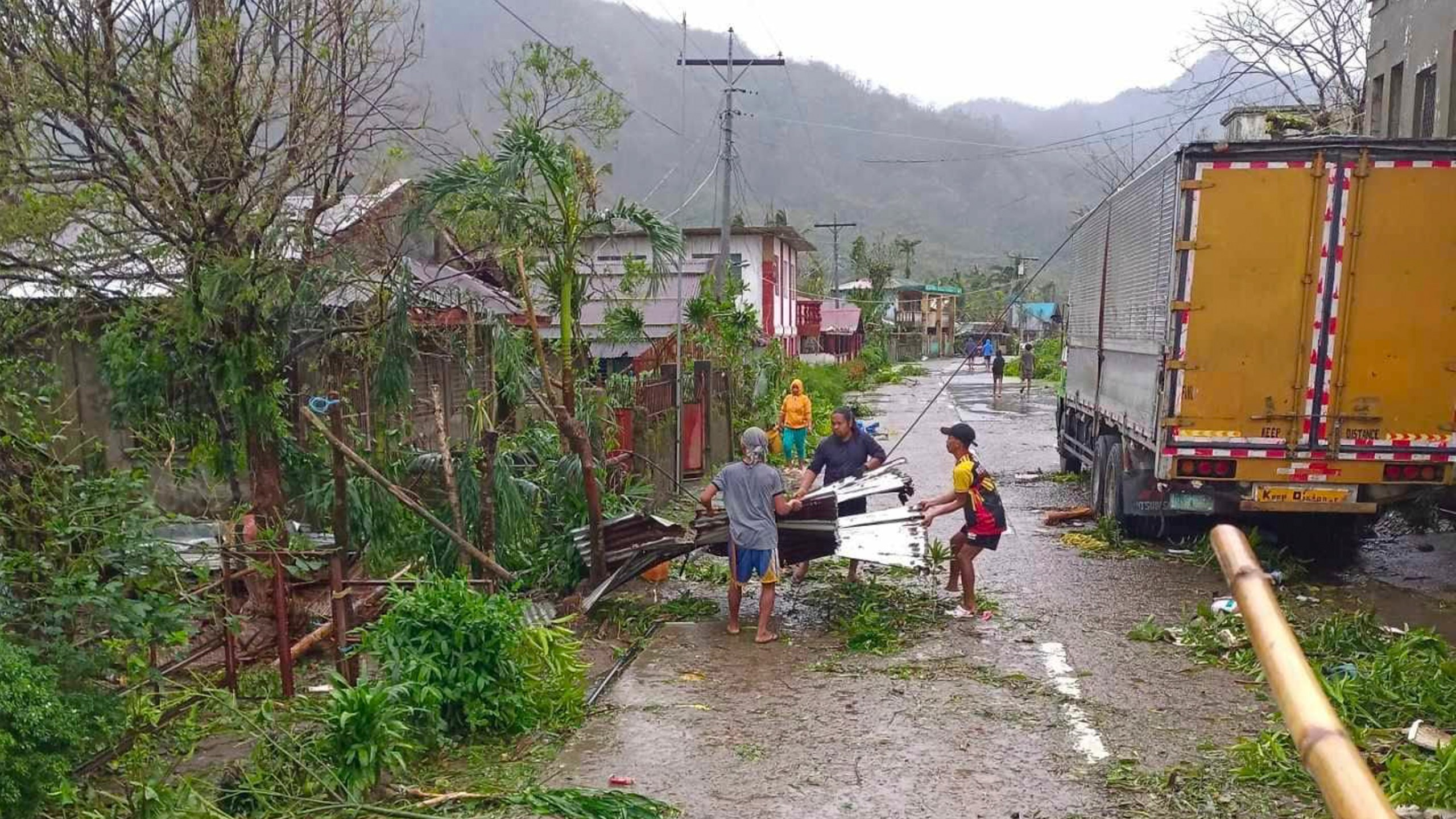 In this photo provided by the MDRRMO Viga Catanduanes, residents try to fix their damaged homes caused by Typhoon Man-yi in Viga, Catanduanes province, northeastern Philippines Sunday, Nov. 17, 2024. (MDRRMO Viga Catanduanes via AP)