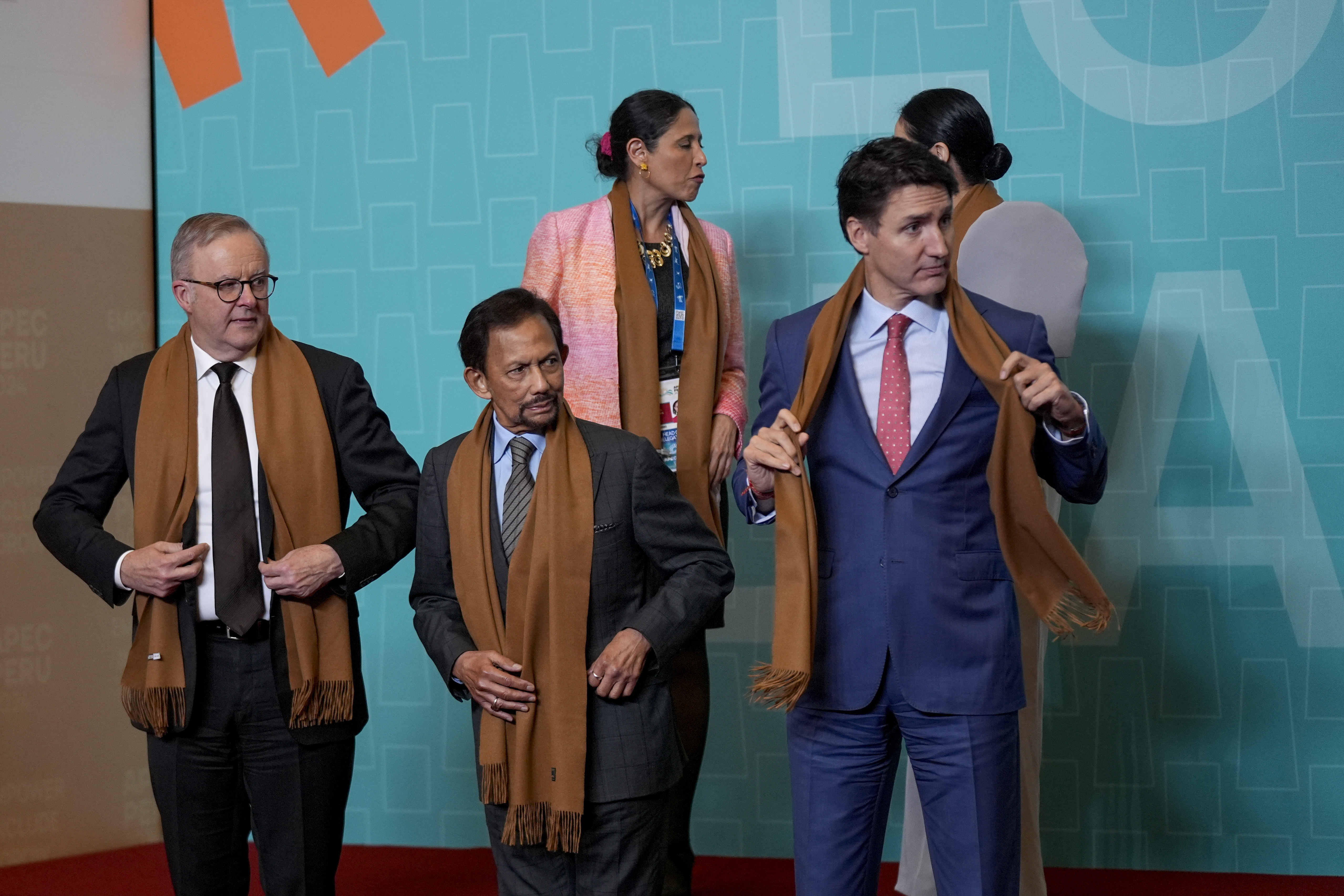 From left, Australia's Prime Minister Anthony Albanese, Brunei's Sultan Hassanal Bolkiah, and Canada's Prime Minister Justin Trudeau gather with other APEC leaders for a family photograph at the APEC Summit in Lima, Peru on Saturday, Nov. 16, 2024. (AP Photo/Manuel Balce Ceneta)